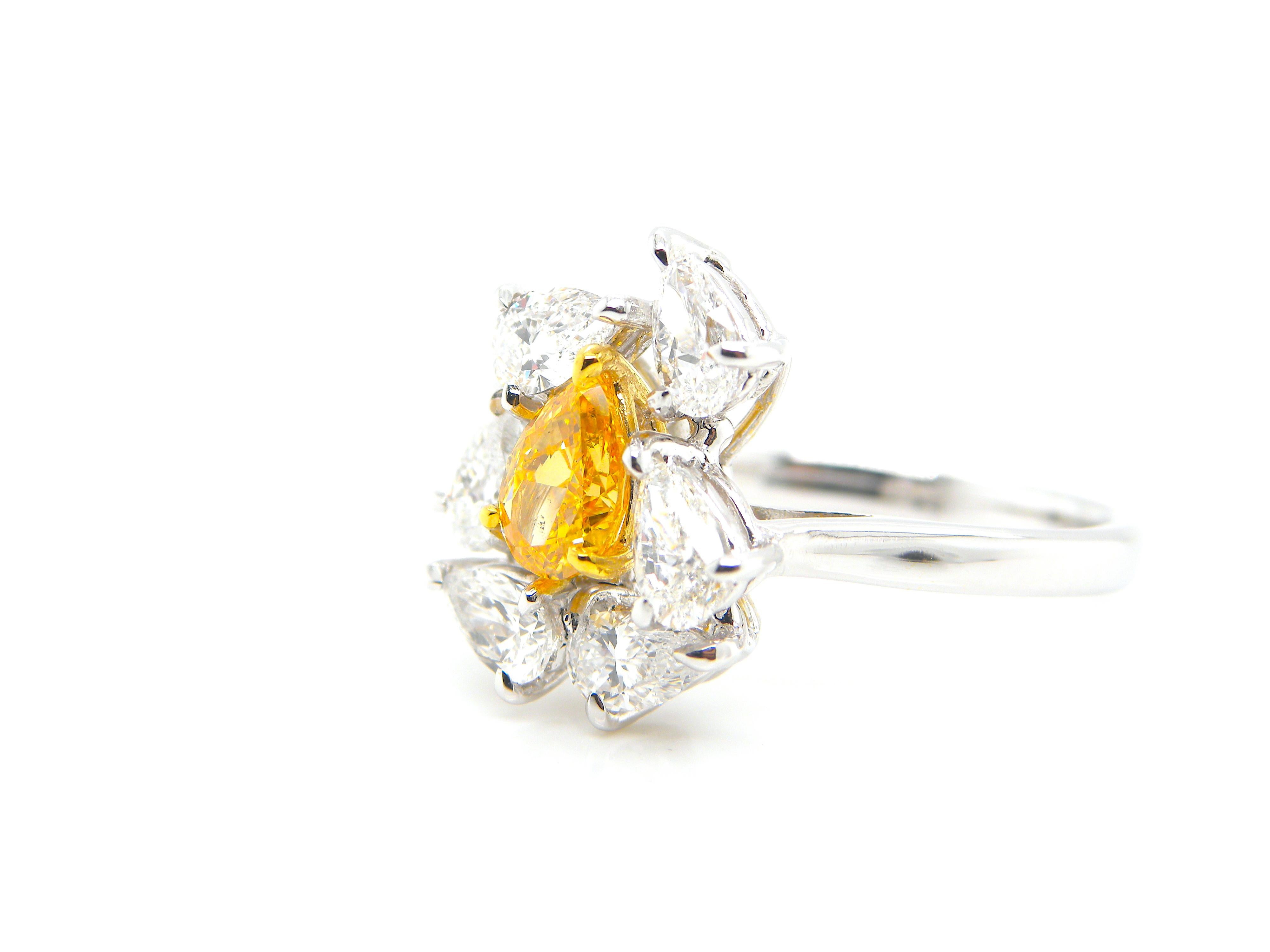 0.67 Carat GIA Certified Fancy Vivid Yellow-Orange Diamond and Diamond Ring 2