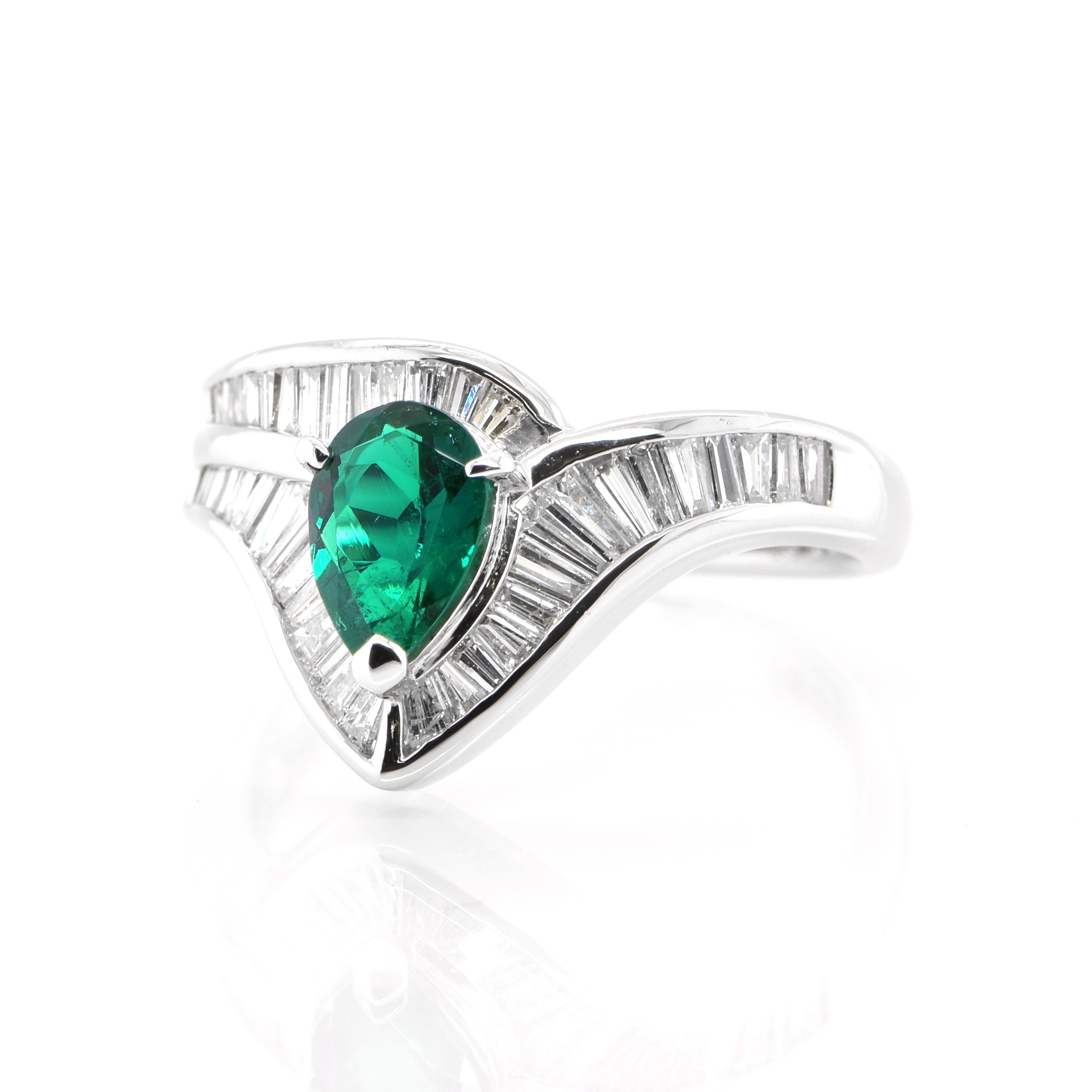 A stunning Engagement ring featuring a 0.67 Carat, Natural, Emerald and 0.81 Carats of Diamond-Baguette Accents set in Platinum. The Emerald displays very good color and clarity which is rare for most Emeralds set in jewelry! The ring is great for