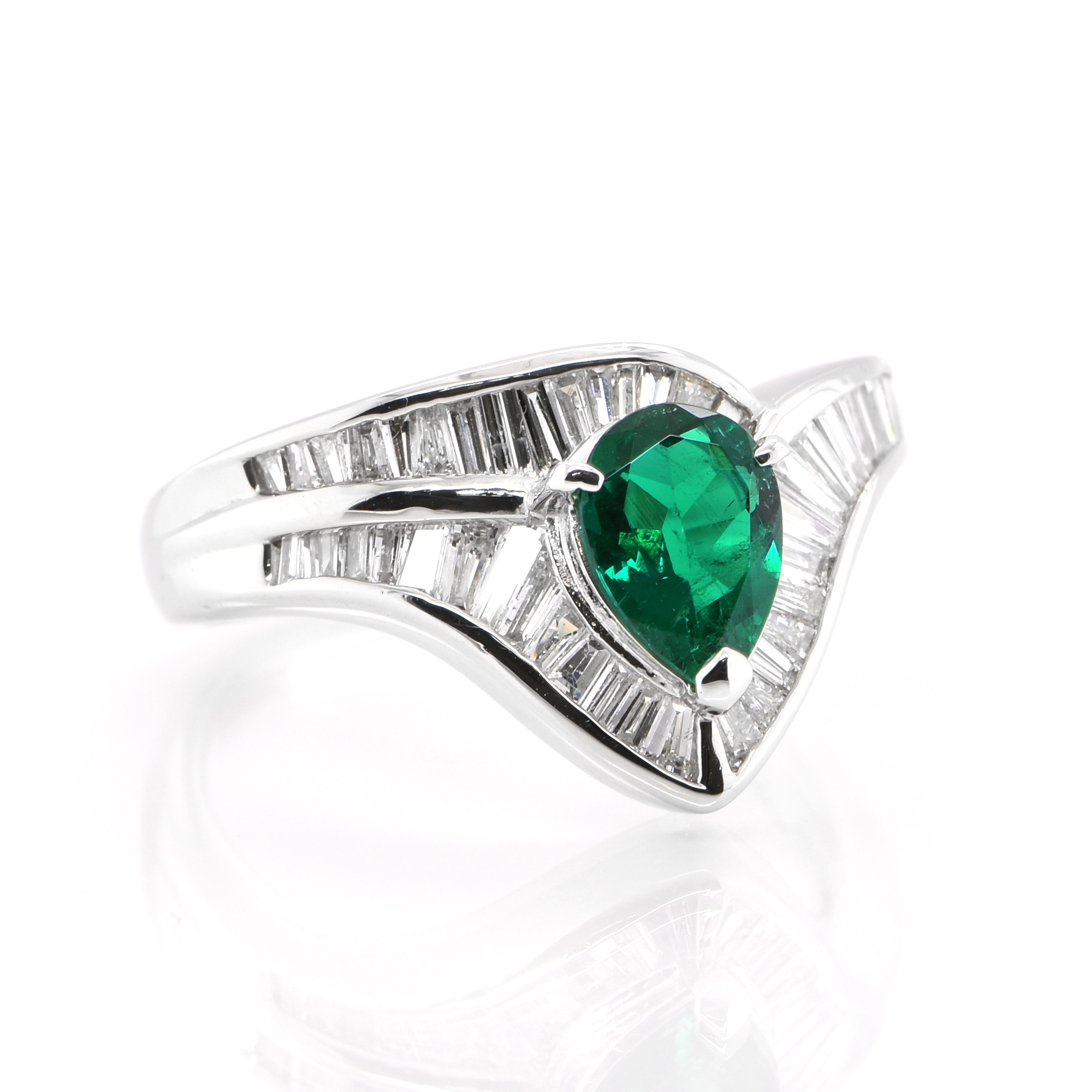 Modern 0.67 Carat Natural Pear Cut Emerald and Diamond-Baguette Ring Set in Platinum