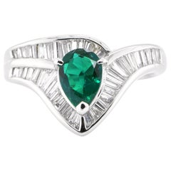 0.67 Carat Natural Pear Cut Emerald and Diamond-Baguette Ring Set in Platinum