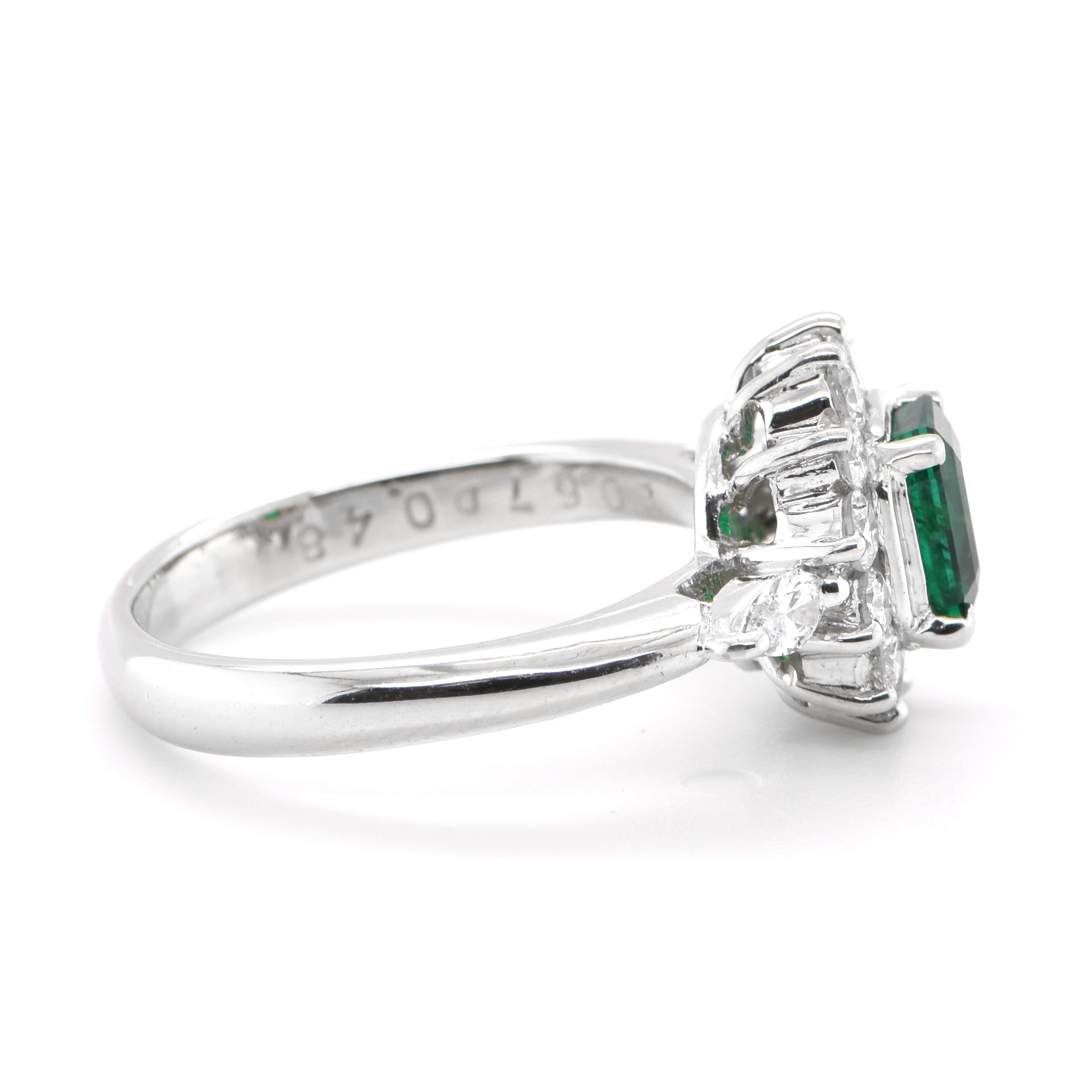 Modern 0.67 Carat Natural Emerald and Diamond Ring Set in Platinum