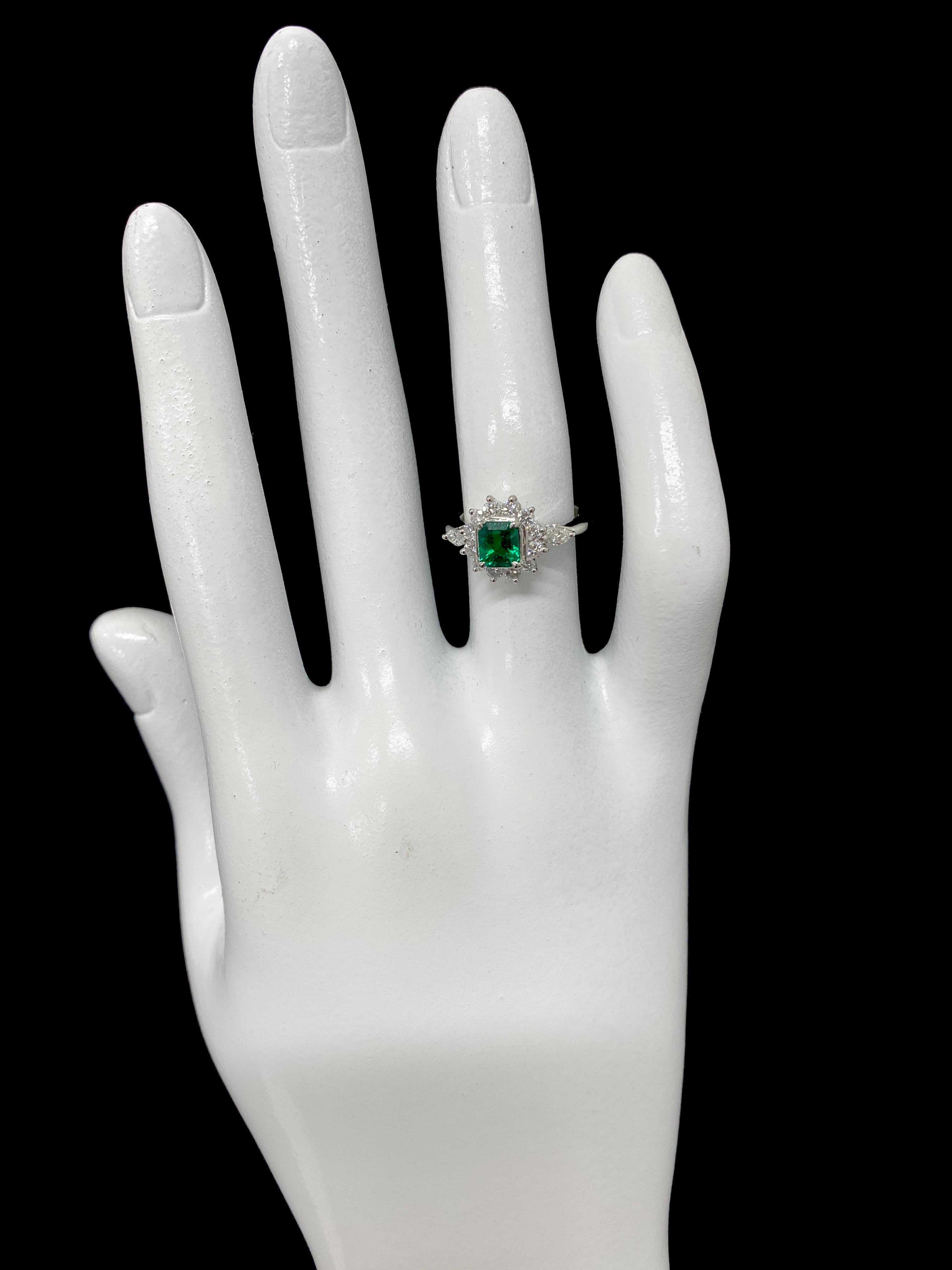 0.67 Carat Natural Emerald and Diamond Ring Set in Platinum 1