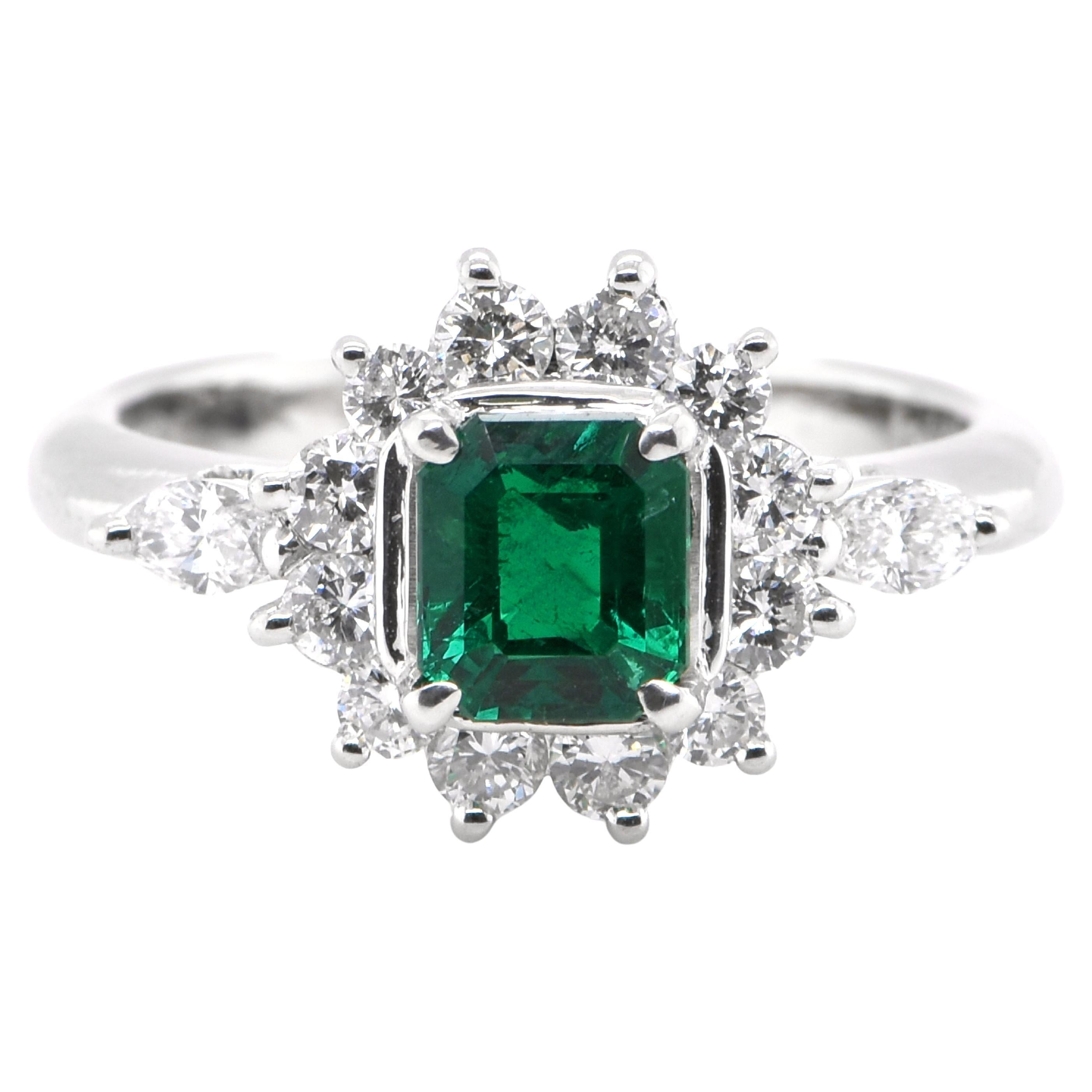 0.67 Carat Natural Emerald and Diamond Ring Set in Platinum