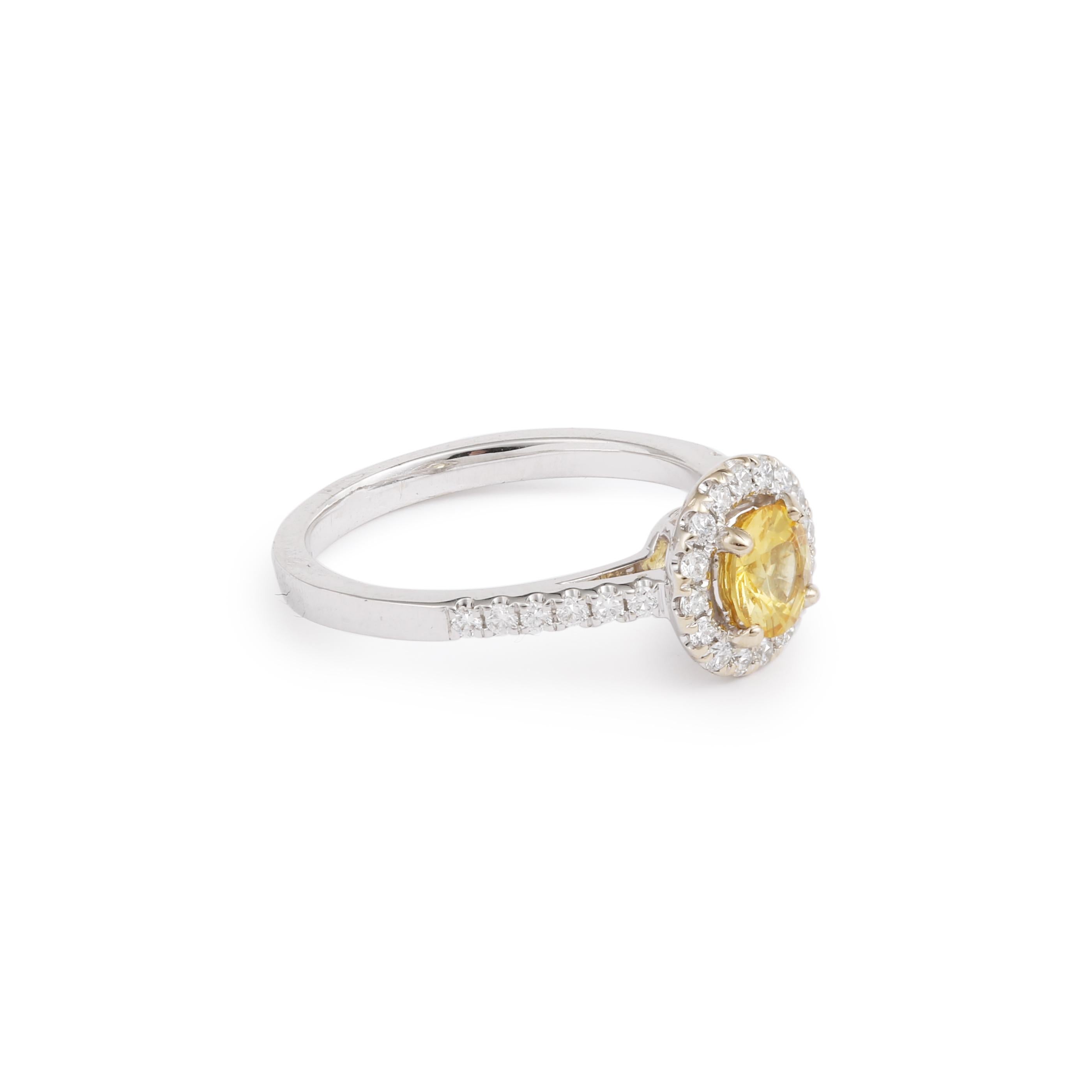 Delicate daisy ring set with a 0.67 ct brilliant-cut yellow sapphire surrounded by pavé-cut diamonds.

One of a kind piece. Ideal engagement ring!

Yellow sapphire weight : 0.67 carats

Pave diamond weight: 0.28 carats

Dimensions: 18.82 x 9.14 x 6