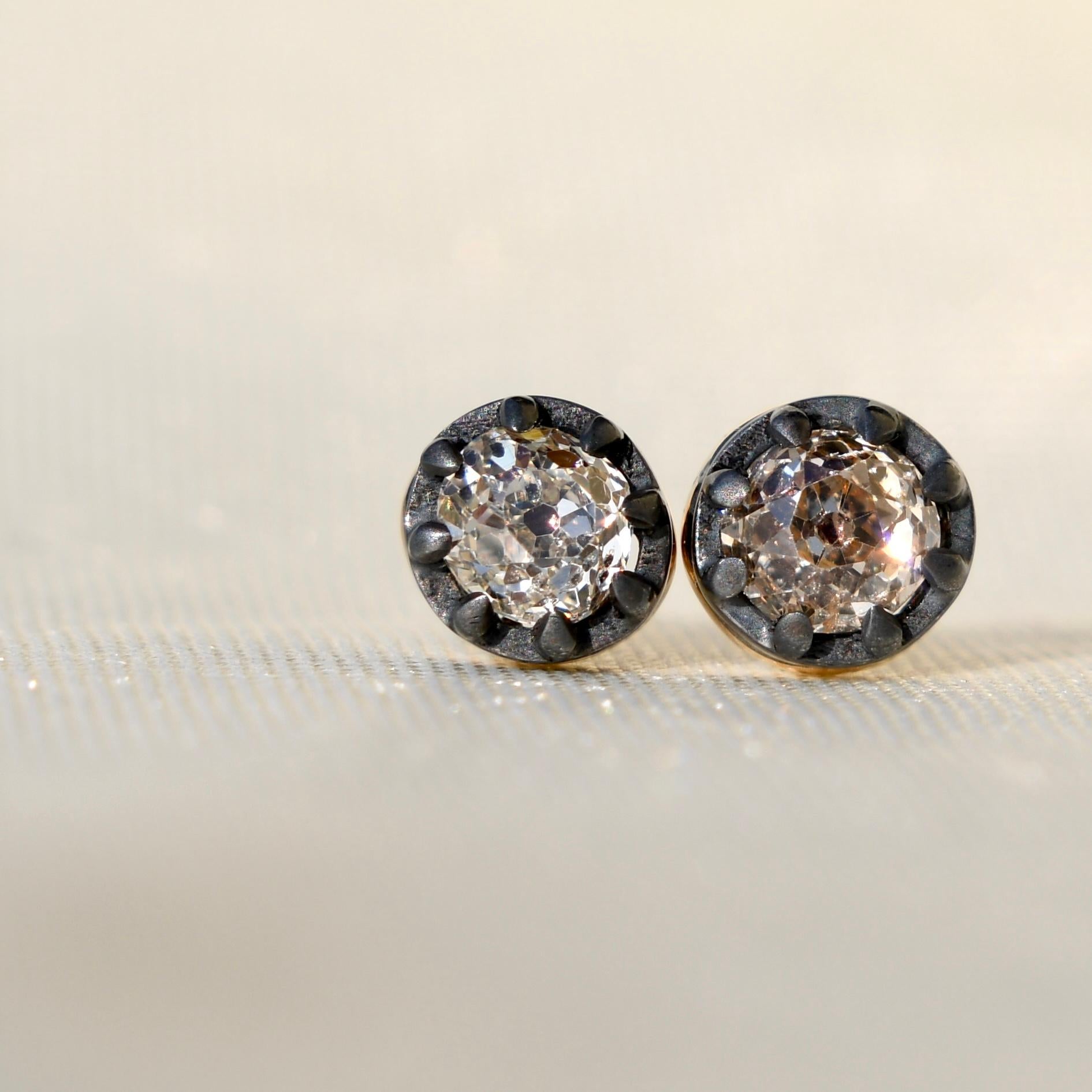 A pair of newly made studs featuring antique diamonds. The diamonds are in excellent condition.

- One old mine cut diamond, 0.32ct (N/ I1)
- One old mine cut diamond, 0.35ct (O-P/ I1) 
- Total diamond weight: 0.67 ct
- 750/ 18k solid yellow gold