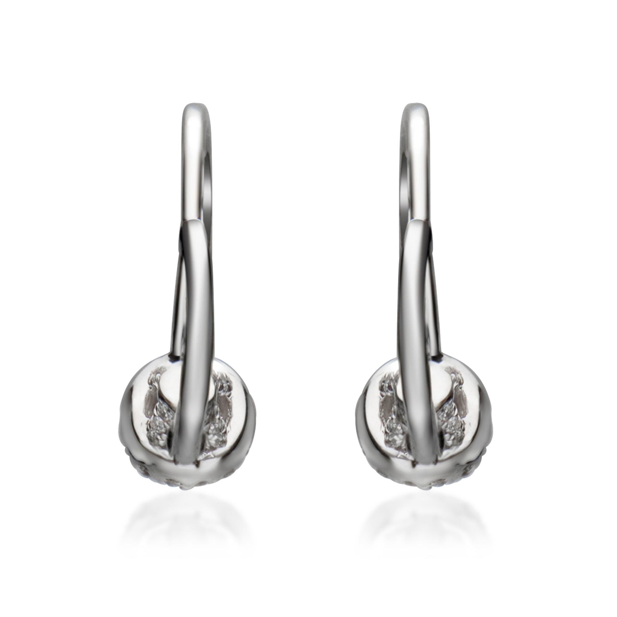 Simple yet elegant, crafted from 14 karat white gold these diamond earrings feature brilliant-cut diamonds with high polished finish for gleaming shine.

Earring Type: Lever back Earrings
Metal: Gold
Gold Karat: 14 Karat white gold
Center Diamonds: