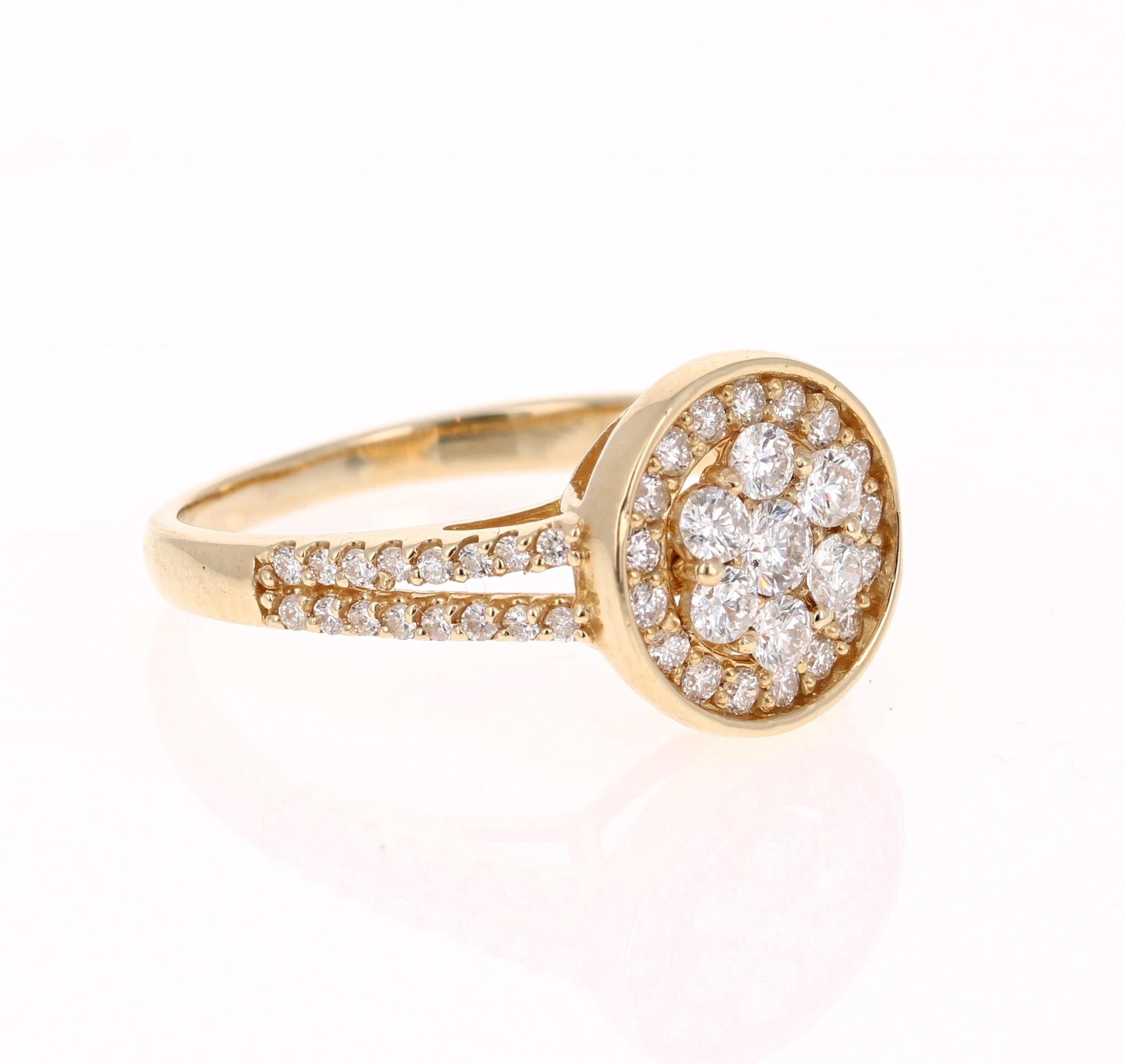 This ring has 56 Round Cut Diamonds that weigh 0.68 Carats. 

It is beautifully set in 14 Karat Yellow Gold and weighs approximately 3.0 grams

The ring is a size 6 1/2 and can be re-sized free of charge. 
