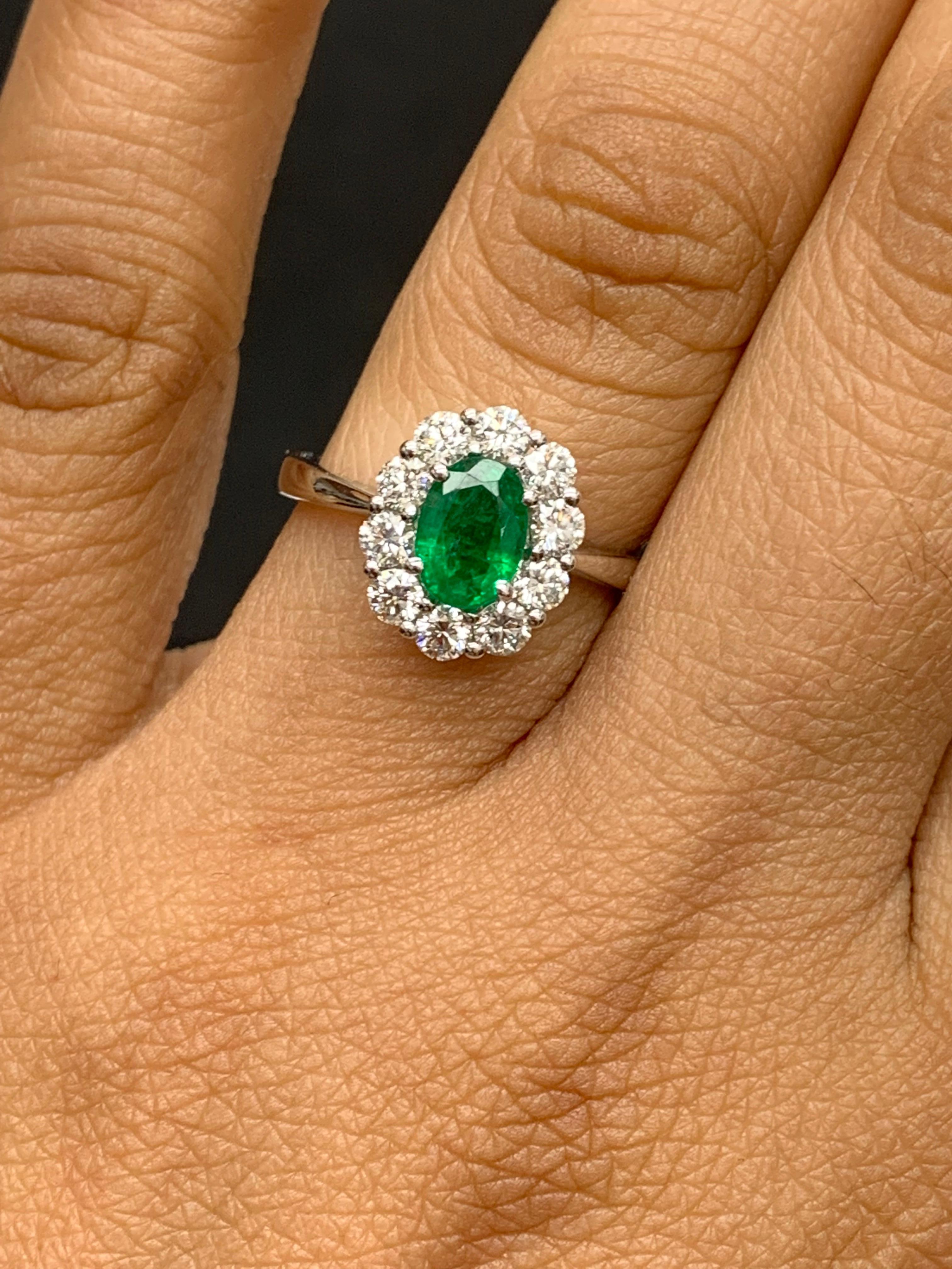Modern 0.68 Carat Oval Cut Emerald and Diamond Ring in 18k White Gold For Sale