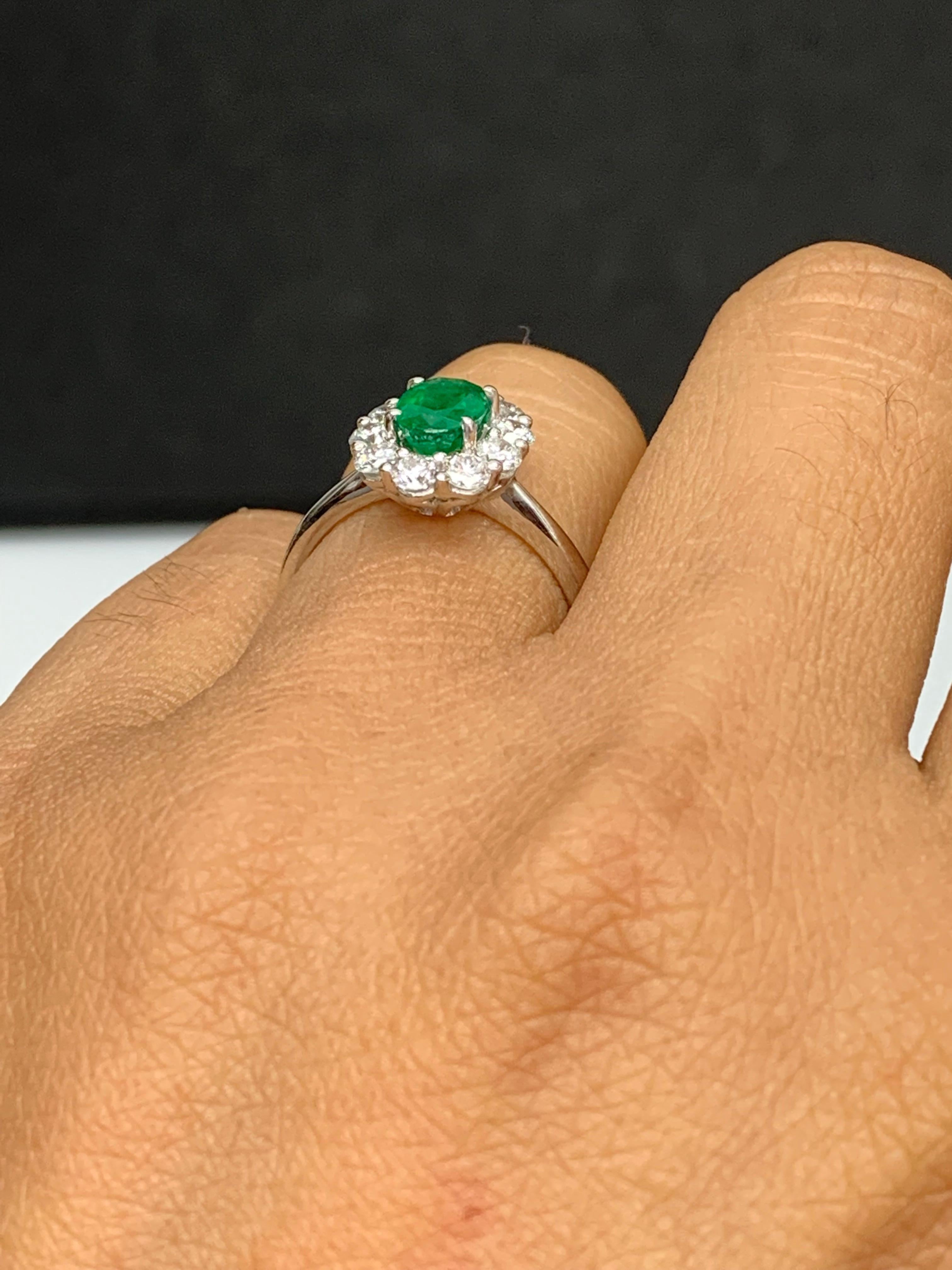 Women's 0.68 Carat Oval Cut Emerald and Diamond Ring in 18k White Gold For Sale