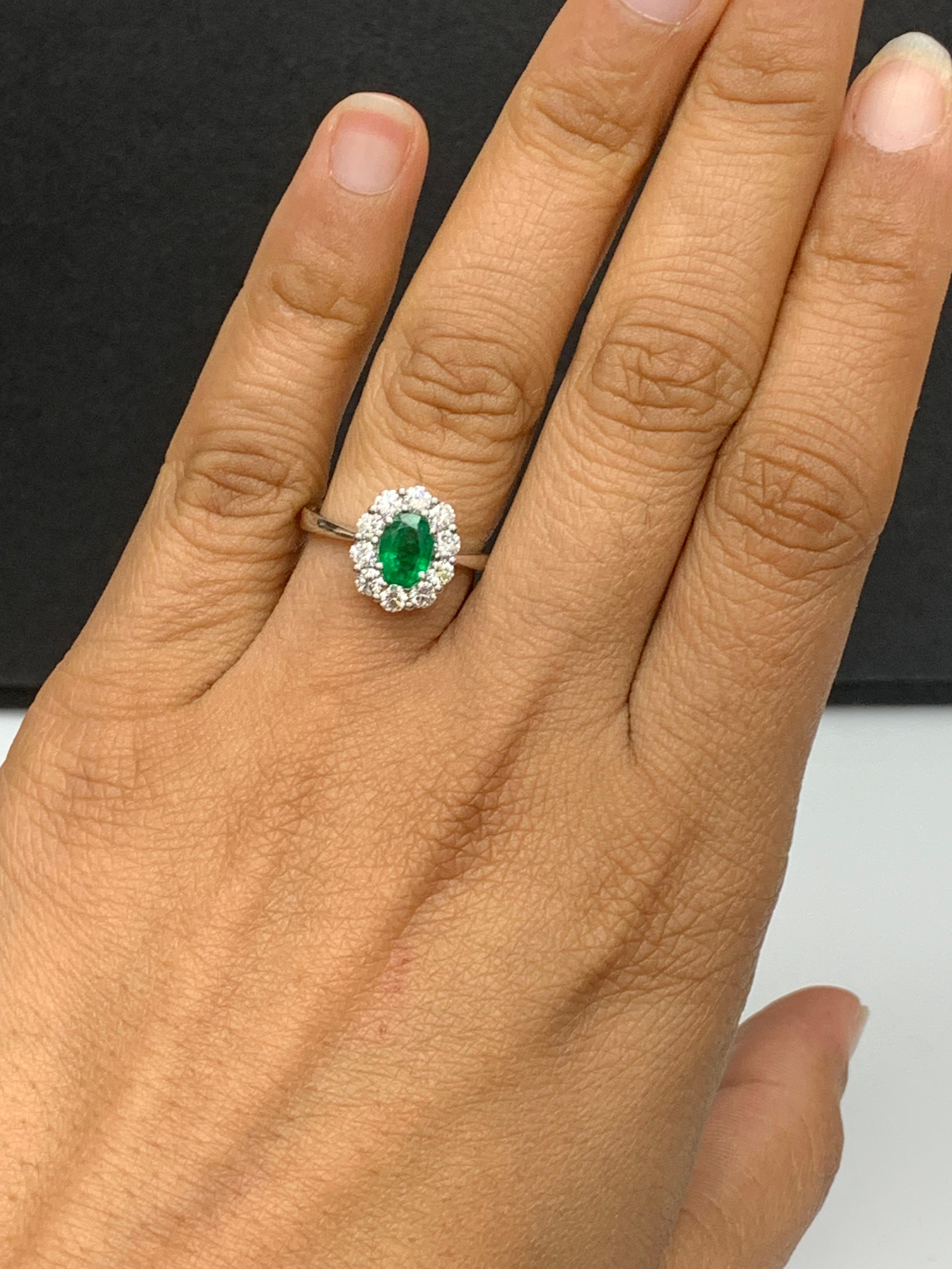 0.68 Carat Oval Cut Emerald and Diamond Ring in 18k White Gold For Sale 1