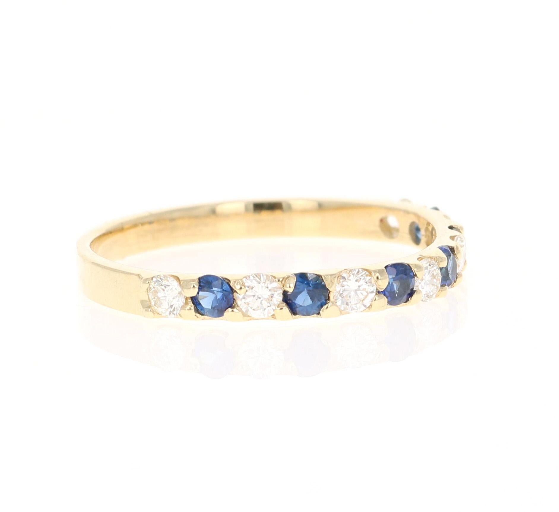 This ring has 6 Blue Sapphires that weigh 0.36 Carats and 7 Round Cut Diamonds that weigh 0.32 Carats. The clarity and color of the diamonds are VS-H. The total carat weight of the ring is 0.68 Carats. 

Crafted in 14 Karat Yellow Gold and is