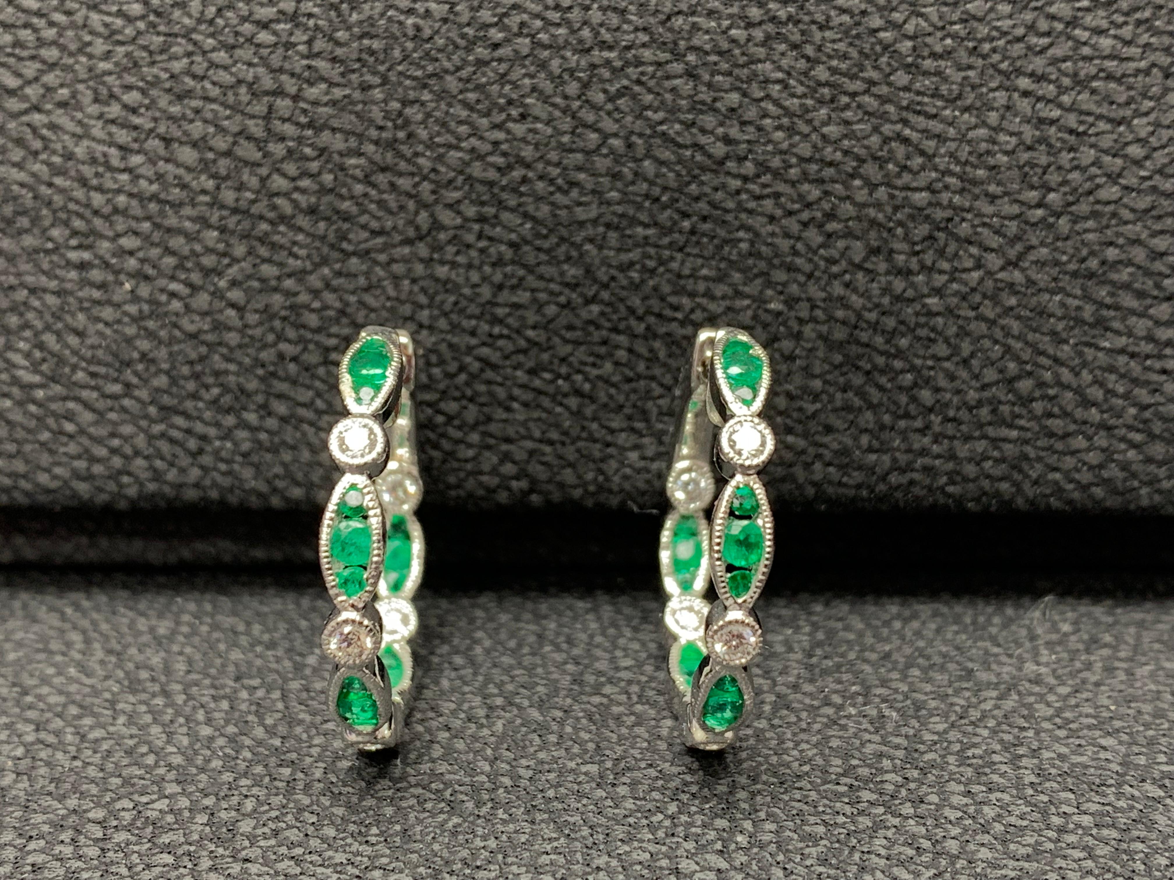 A unique piece of hoop earrings showcasing a row of  30 round Emeralds and 10 diamonds, set in a bezel made in 18k white gold. Rubies weigh 0.68 carats and Diamonds weigh 0.28 carats total.
Style available in different price ranges. Prices are based