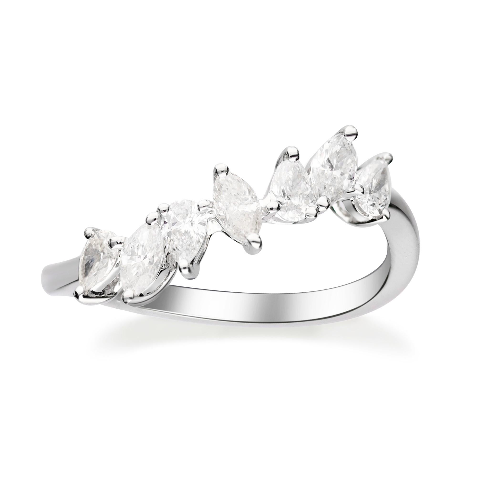 This beautiful ring is crafted in 18-karat White gold and features a 3 Marquise Diamond 0.33 Carat & 4 Pear shaped Diamonds 0.35 carat in prong-settings in GH - VS quality. 
This ring comes in size 7 and can be resized to 6 & 8. It is a perfect gift
