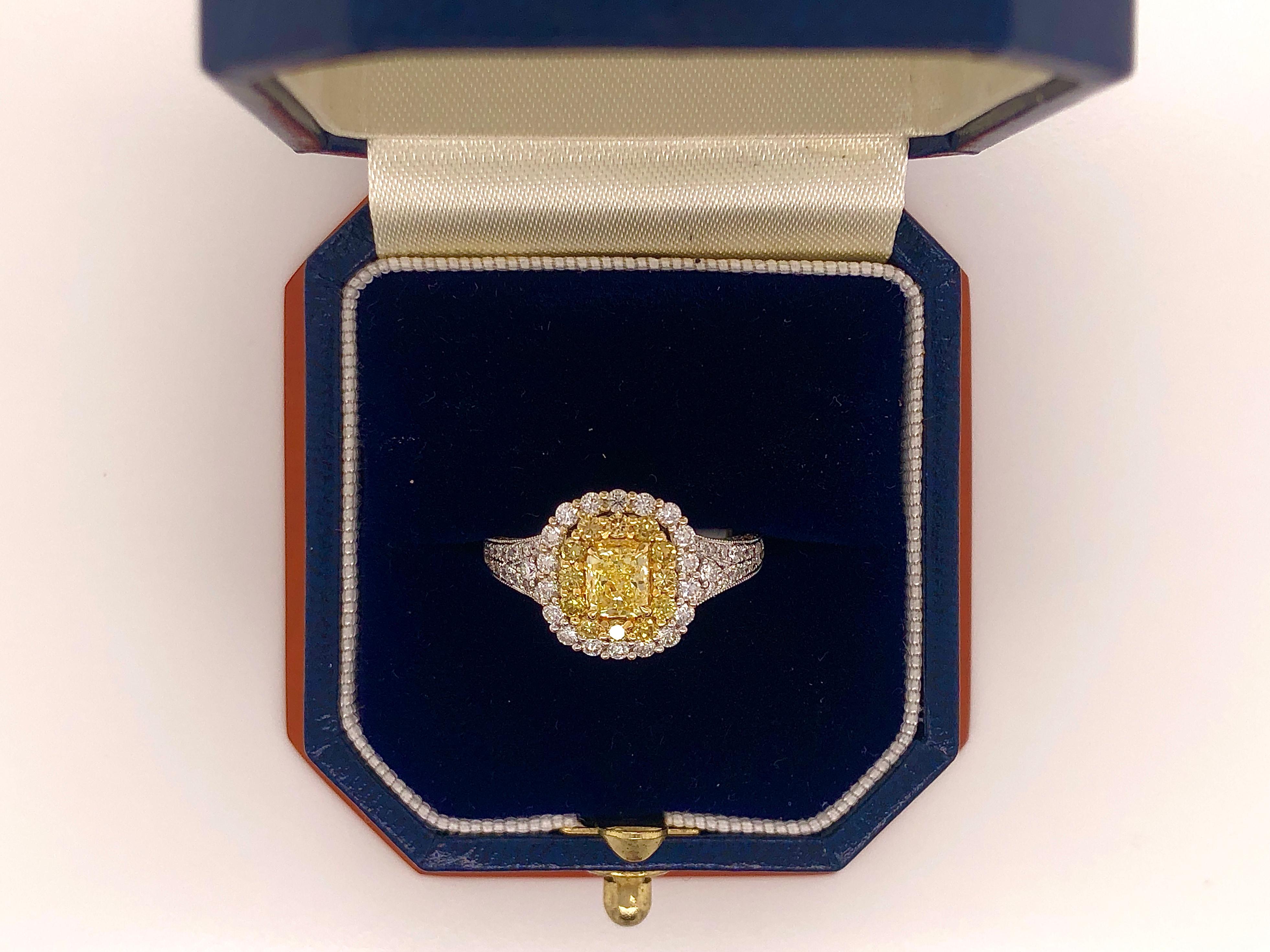 Women's or Men's 0.68 Carat Fancy Yellow Diamond in 18 Karat Gold Cushion Shaped Double Halo For Sale