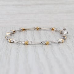 Bracciale con diamanti gialli bianchi da 0,68 ct. in oro giallo bianco 18 carati con catena da 7,5".