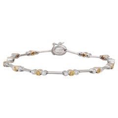 Bracciale con diamanti gialli bianchi da 0,68 ct. in oro giallo bianco 18 carati con catena da 7,5".