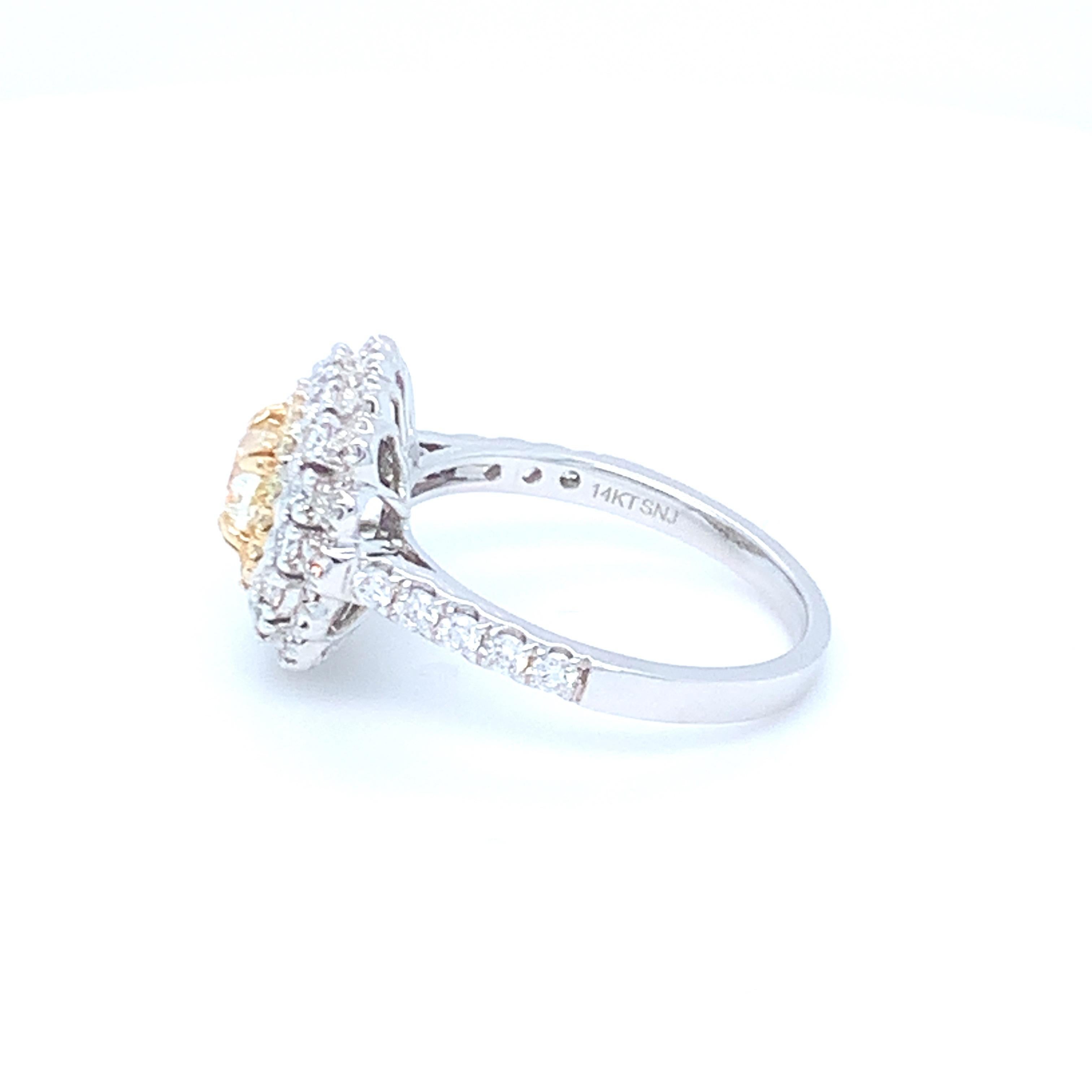 0.69 Carat Cushion Yellow Diamond White Diamond Halo Ring Set in 14 Karat Gold For Sale 3