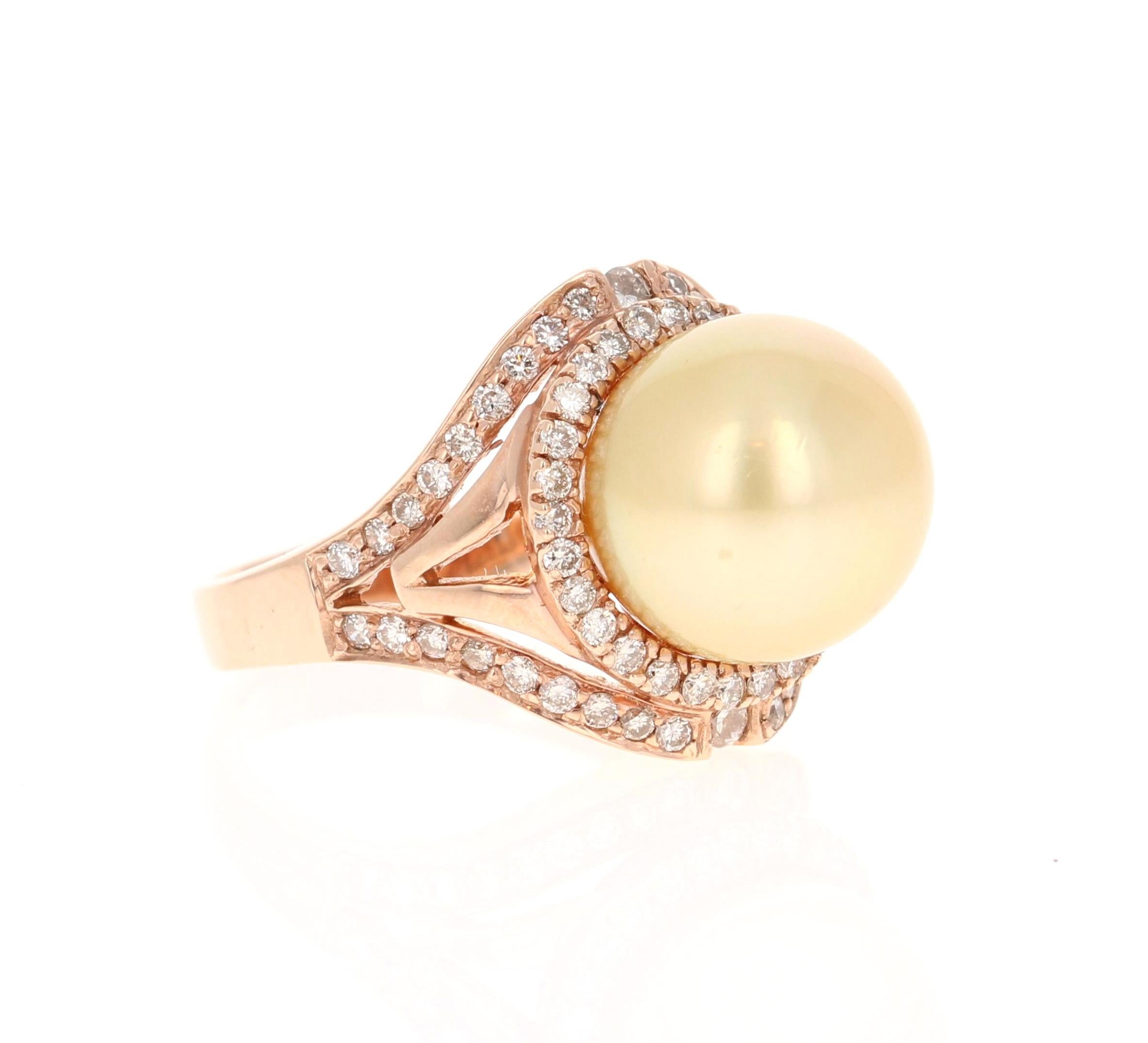 This beautiful South Sea Pearl Diamond ring has an 11.5 mm South Sea Golden Pearl and is surrounded by 66 Round Cut Diamonds that weigh 0.69 carats. (Clarity: VS, Color: F)

The gorgeous setting weighs approximately 6.9 grams. 
The ring size is 7