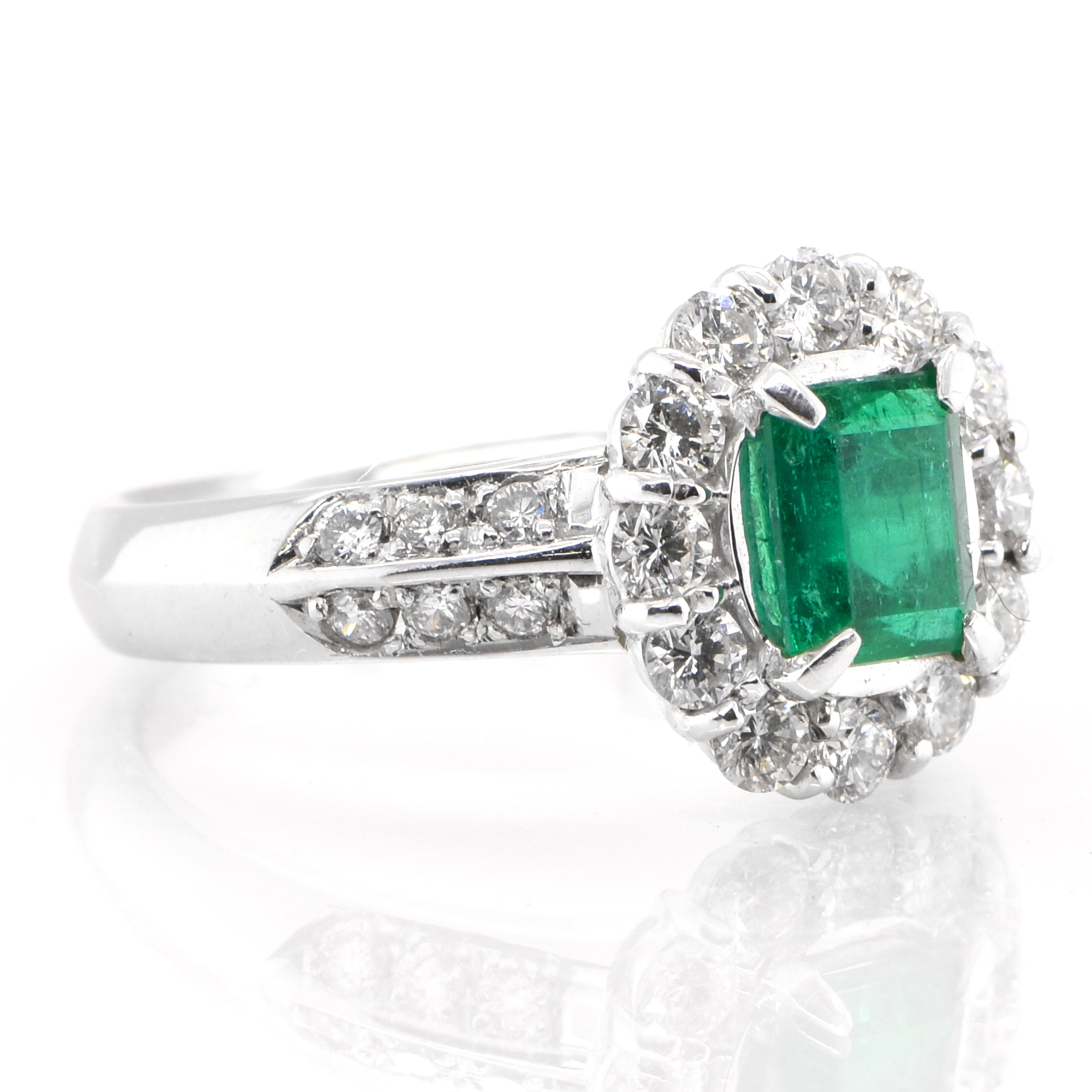 Modern 0.69 Carat Natural Emerald and Diamond Engagement Ring Set in Platinum