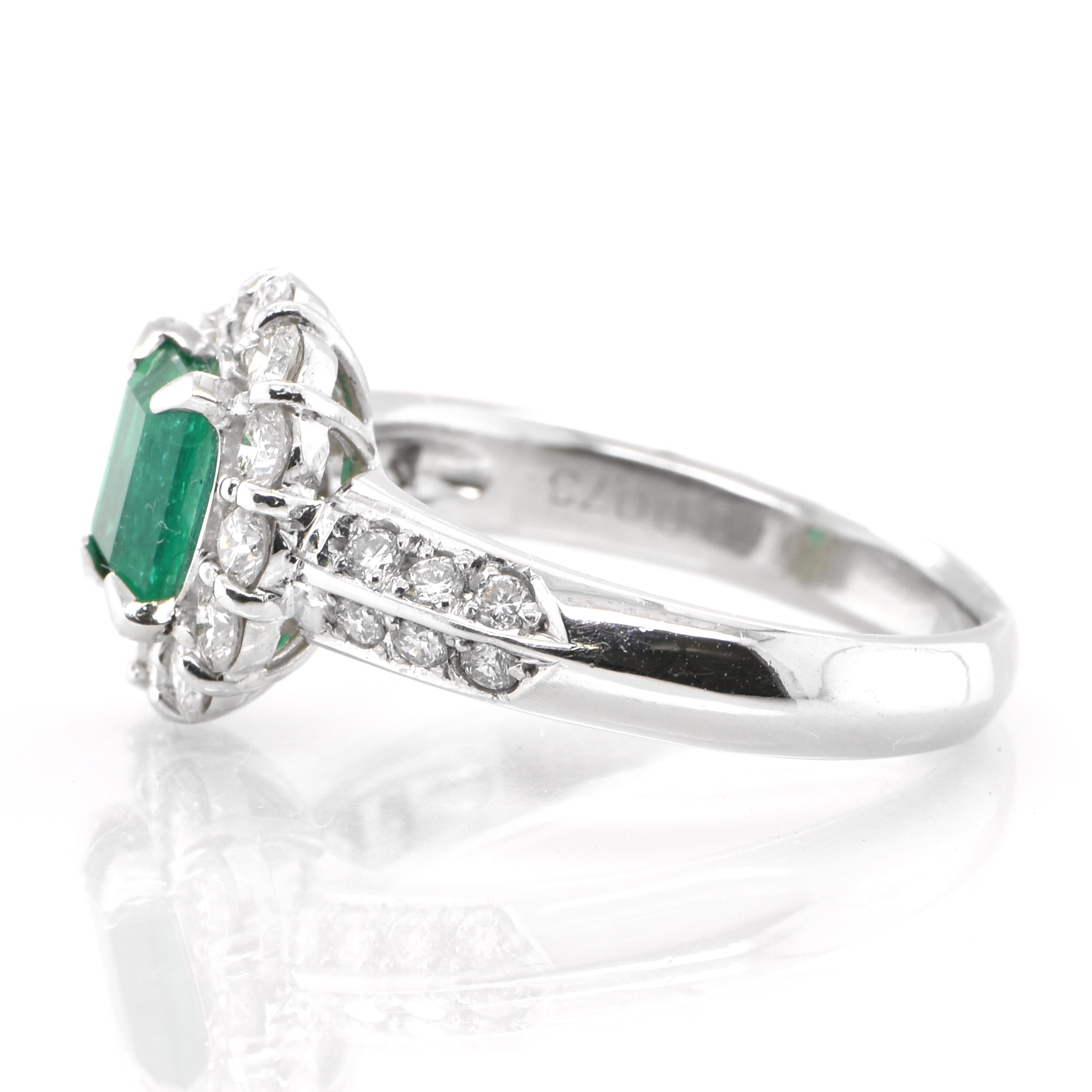 Emerald Cut 0.69 Carat Natural Emerald and Diamond Engagement Ring Set in Platinum