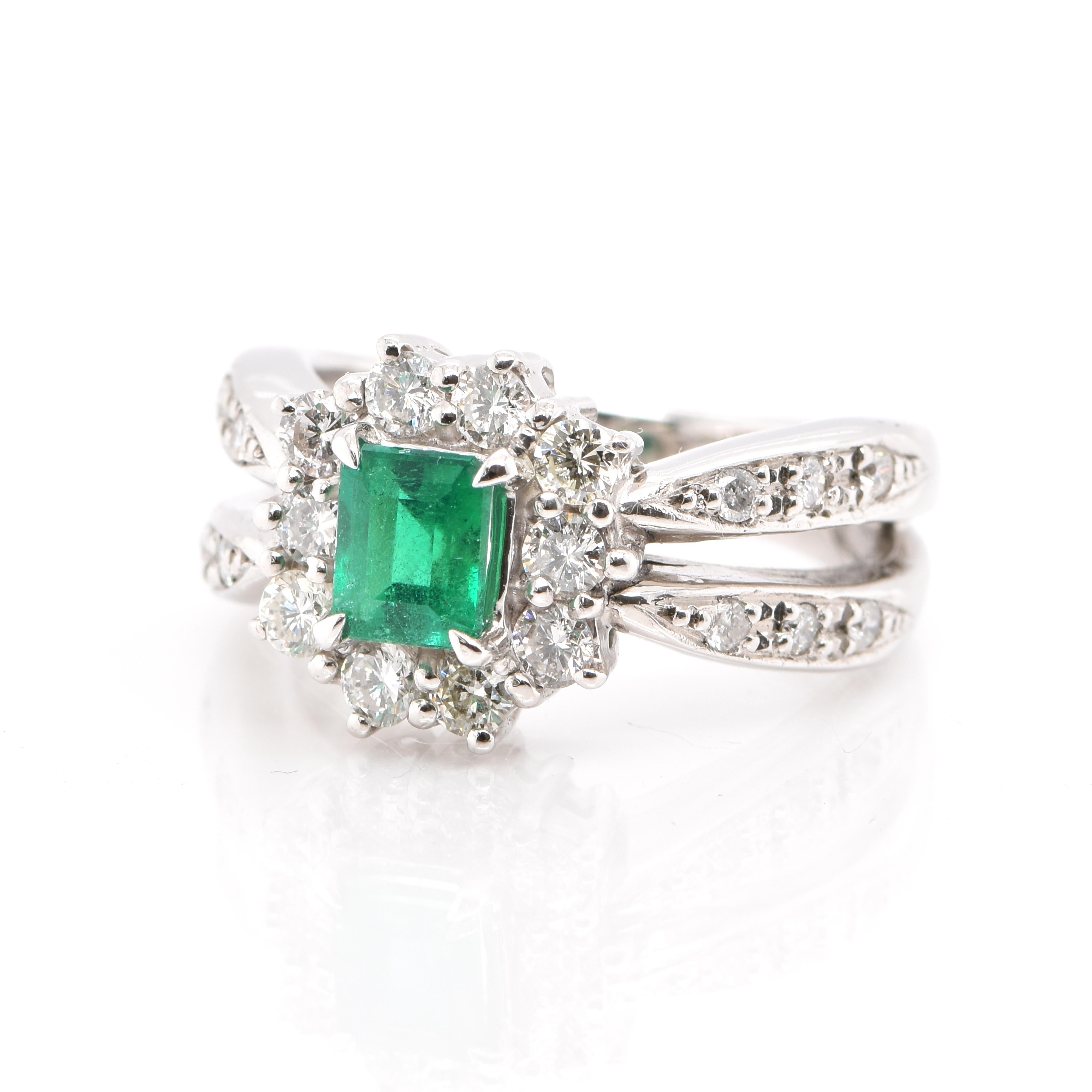 A beautifully made Ring with a 0.69 Carat, Natural Emerald and 0.64 Carats of White Round Brilliant Diamond Accents set in Platinum. People have admired emerald’s green for thousands of years. Emeralds have always been associated with the lushest