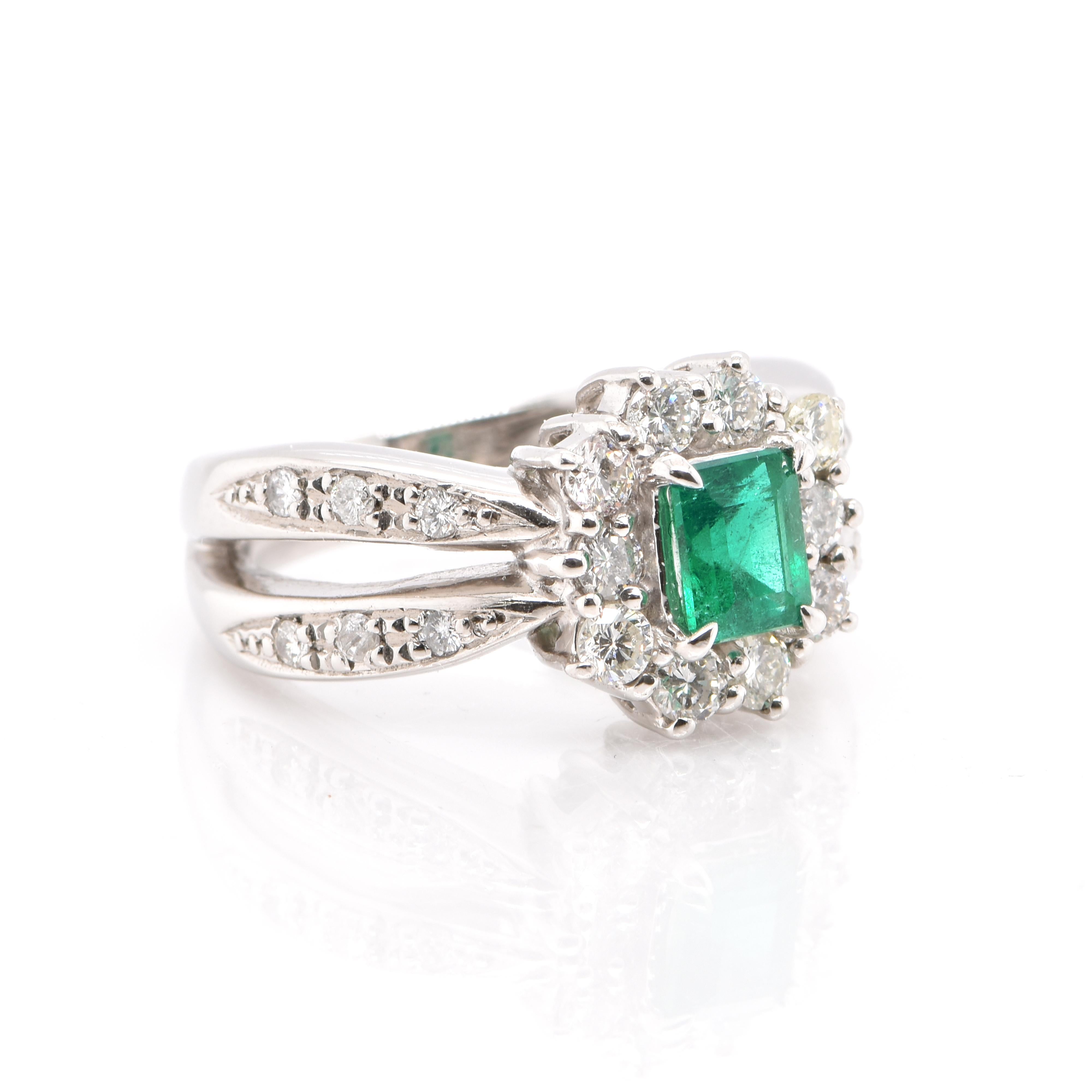 Modern 0.69 Carat Natural Emerald and Diamond Ring Set in Platinum For Sale
