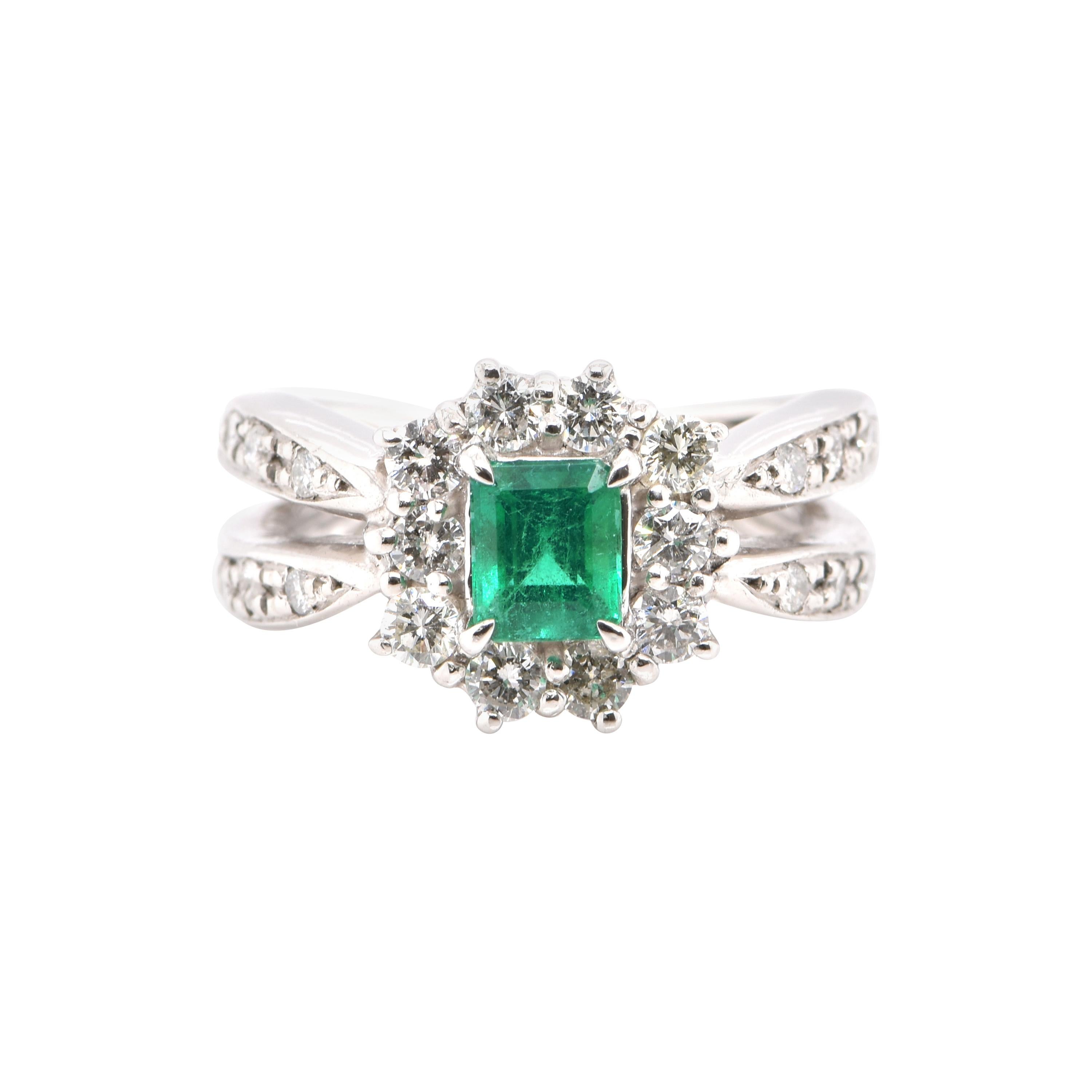 0.69 Carat Natural Emerald and Diamond Ring Set in Platinum For Sale