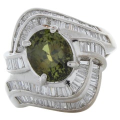 Bague cocktail en or blanc 18 carats avec émeraude ovale de 0,69 carat et diamants