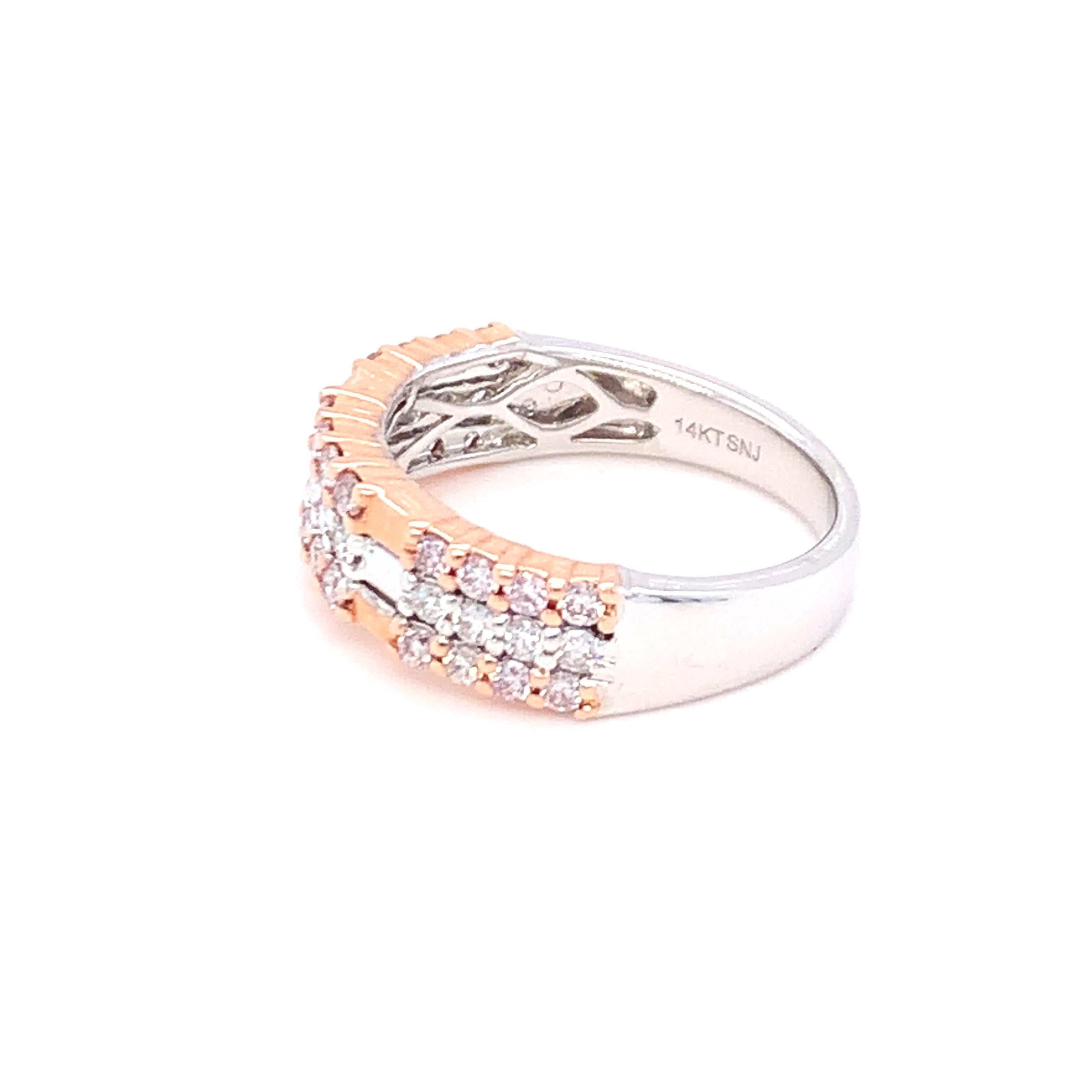 A perfect blend of pink and white diamonds in three rows makes this band a tribute to modern bold women. Set in two tone gold and carefully finished with skilled hands.
Pink Diamond: 0.46ct
White Diamond: 0.23ct
Gold: 14K Two Tone
Ring Size:7

