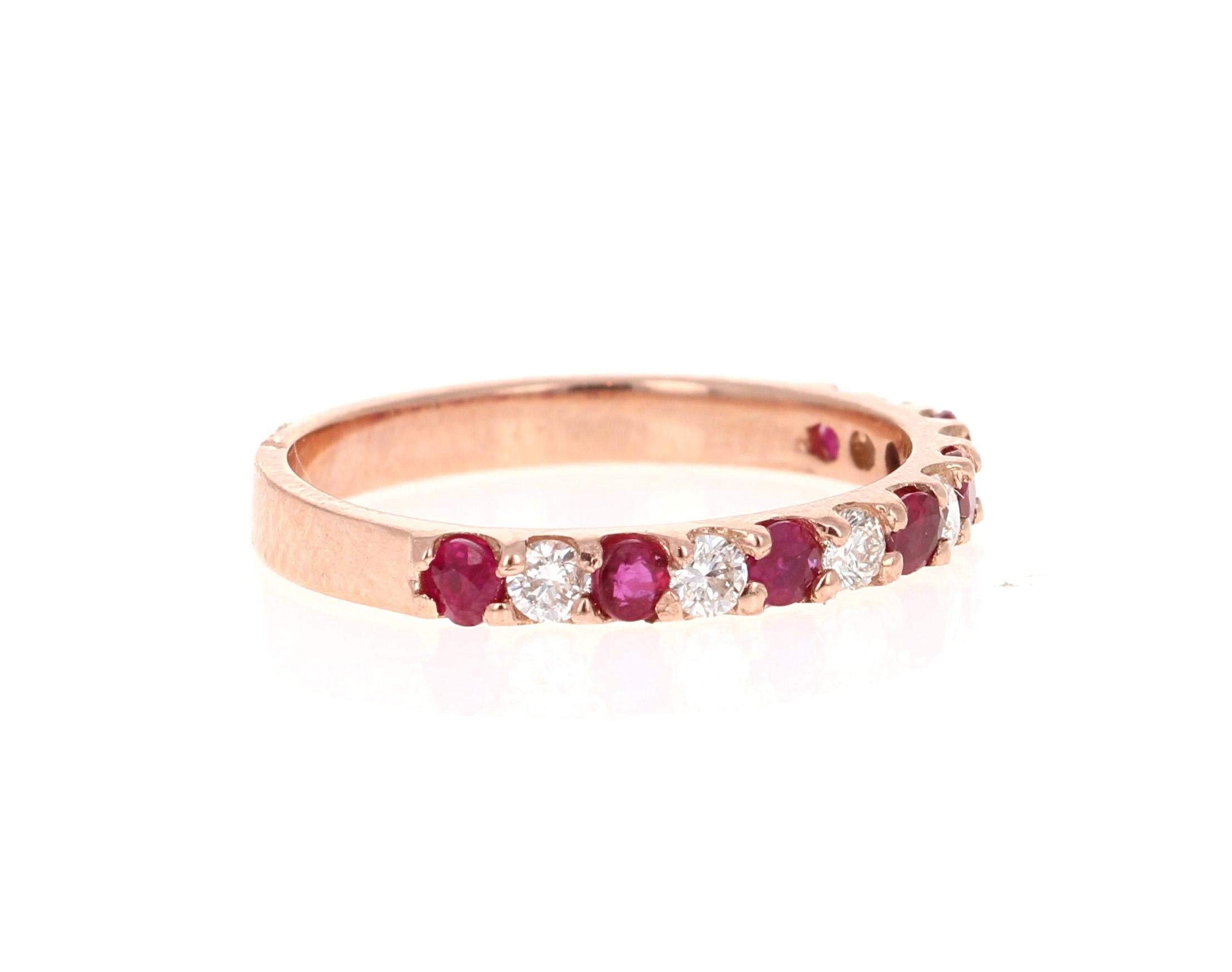 Elegant and classy 0.69 Carat Diamond and Ruby band that is sure to be a great addition to your collection!   

There are 6 Round Cut Diamonds that weigh 0.29 Carats (Clarity: SI2, Color: F) and 7 Round Cut Rubies that weigh 0.40 Carats. The total