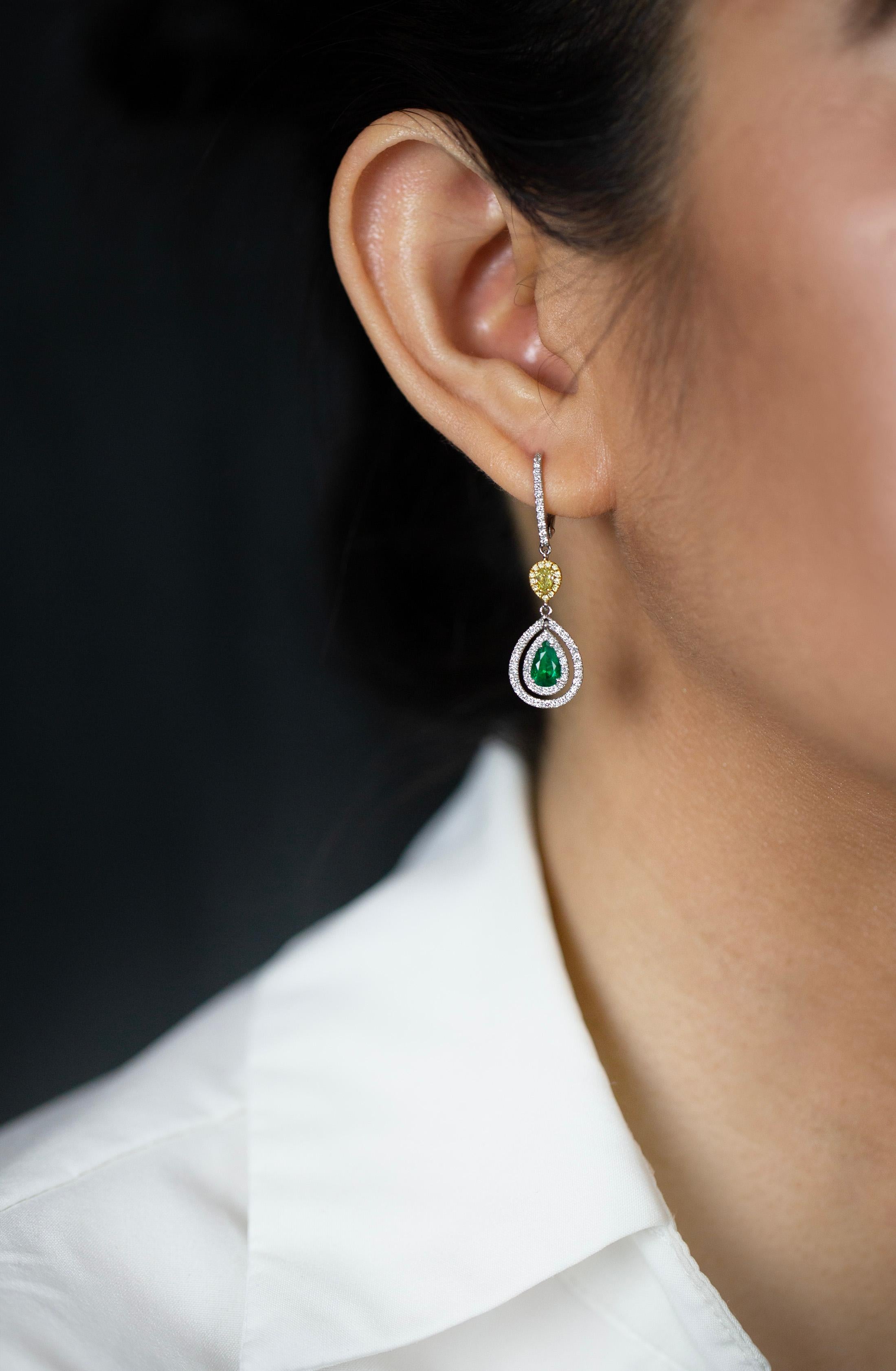 Modern 0.69 Carats Total Pear Shape Green Emerald & Yellow Diamond Halo Dangle Earrings For Sale