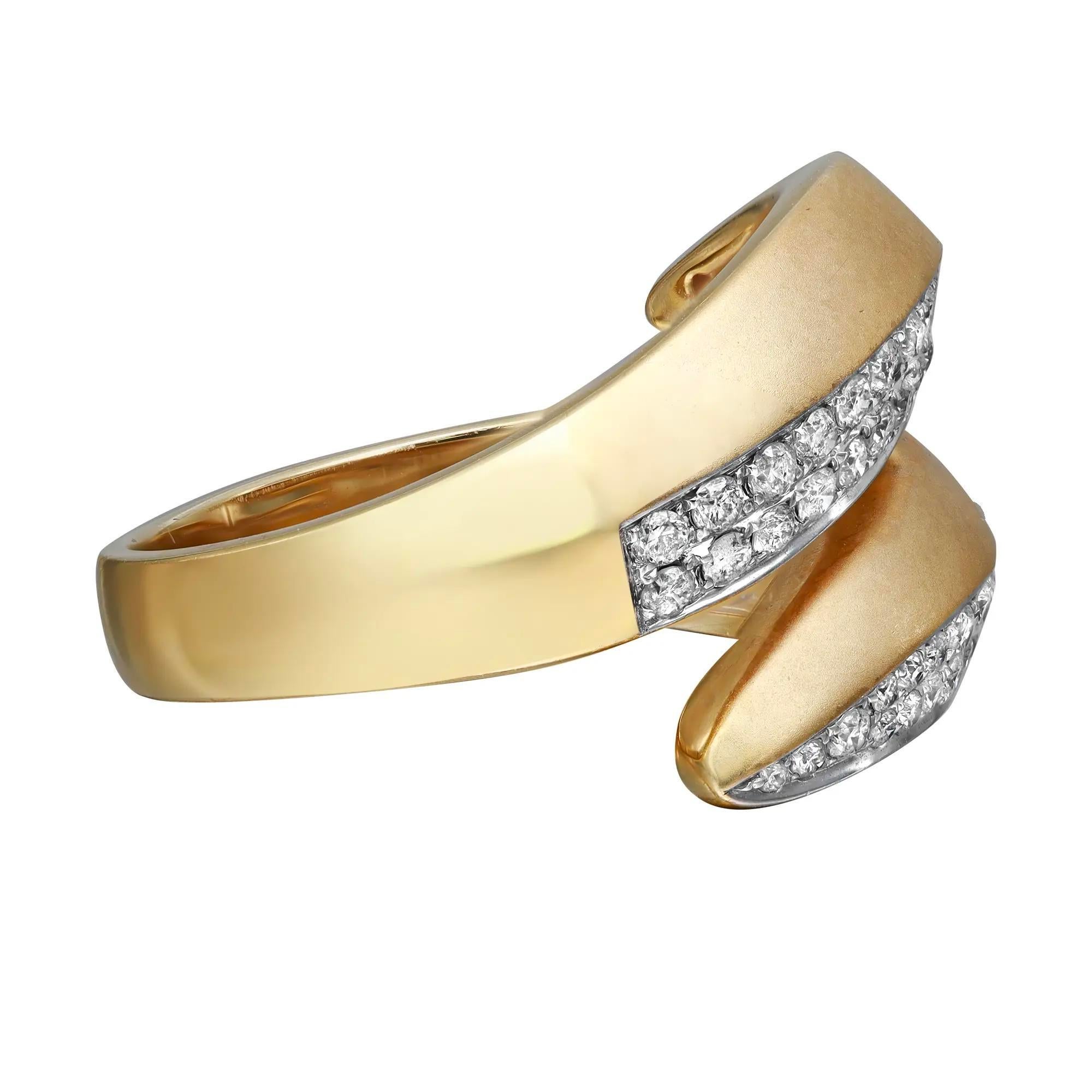 Bold and elegant diamond statement ring rendered in matt and highly polished 14K yellow gold. This ring features sparkling round brilliant cut diamonds in pave setting totaling 0.69 carat. Diamond quality: I color and SI clarity. Ring size: 7.25.