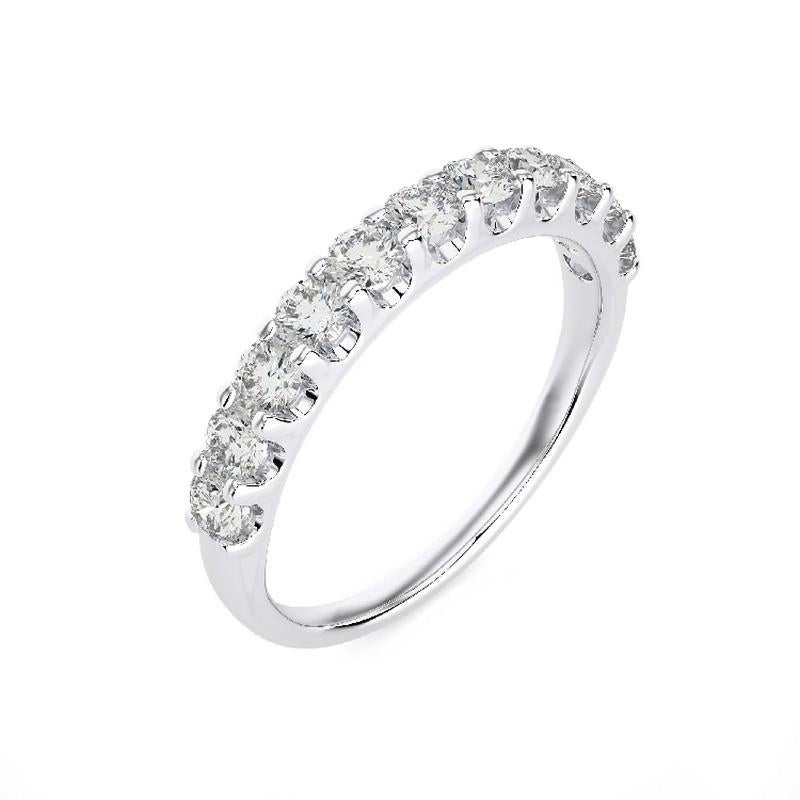 Diamonds: Eleven meticulously selected round diamonds grace this wedding ring, each securely set in a classic prong setting to maximize their brilliance. The total carat weight of 0.7 carats ensures a captivating and enduring sparkle.

Gold Setting: