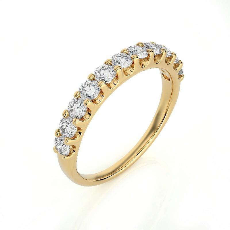Diamonds: Eleven meticulously selected round diamonds grace this wedding ring, each securely set in a classic prong setting to maximize their brilliance. The total carat weight of 0.7 carats ensures a captivating and enduring sparkle.

Gold Setting: