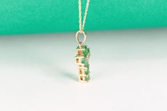 0.7 Carat Round Cut Emerald Diamond Accents 10K Yellow Gold Pendant