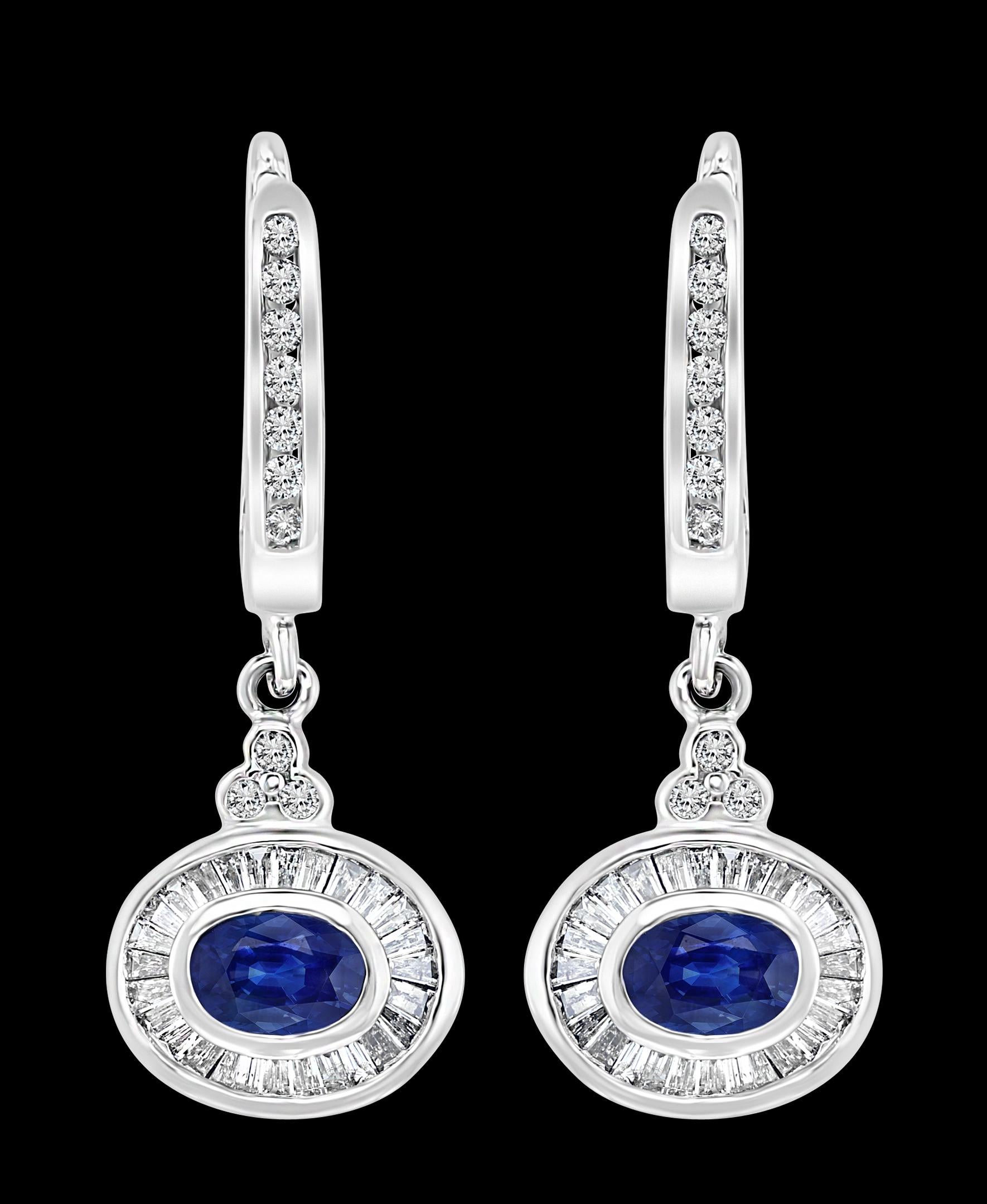 Approximately 0.7 Ct Natural Blue Sapphire and 0.75 Ct Diamond Huggie Earrings  14 Karat Gold 
A fabulous pair of earrings with an enormous amount of look and sparkle!
Set  in  14 Karat white gold
Weight of gold 5.4  Grams
The length of the earrings