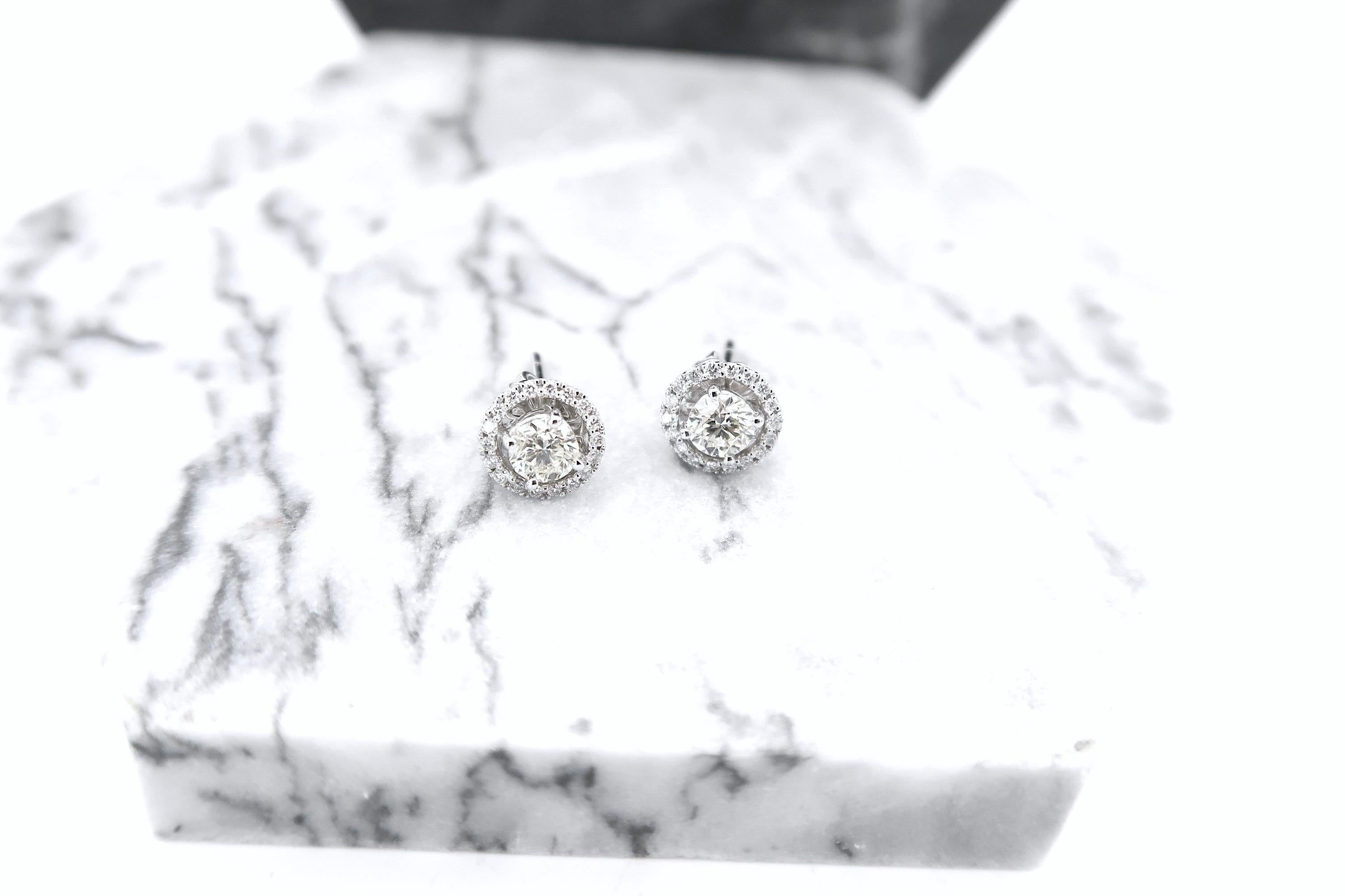 Solitaire Diamond Studs with Detachable Diamond Halo Jackets in 18 Karat White Gold

Diamond: I colour, VS, 0.9 total carat weight, with centre pieces weighing approx. 0.35 ct each

Dimensions: approx. 7 mm diameter

If you wish to have new earrings