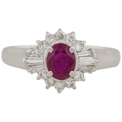 Platinum 0.70ct Oval Ruby Surrounded By 0.43ct Baguette Diamonds Ring
