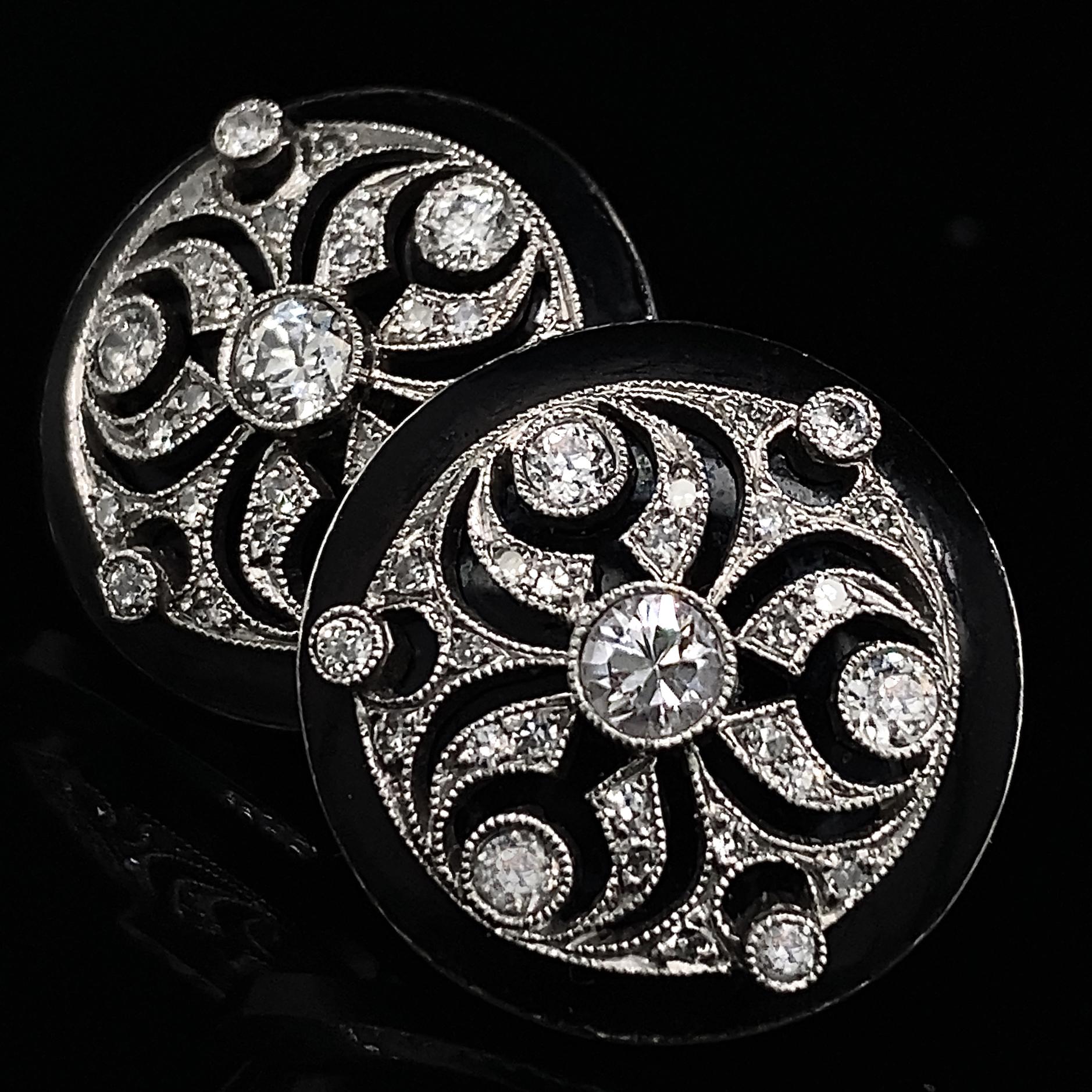 These evocative earrings are skillful reproductions of late Victorian ear drops that would have hung from wires, hooked at the back.  This updated version attaches directly to the ear with posts.  

Platinum rounds with a cutout trefoil design are
