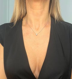 0.70 Carat Diamond Heart Pendant Necklace Suspended from a Platinum Figaro Chain