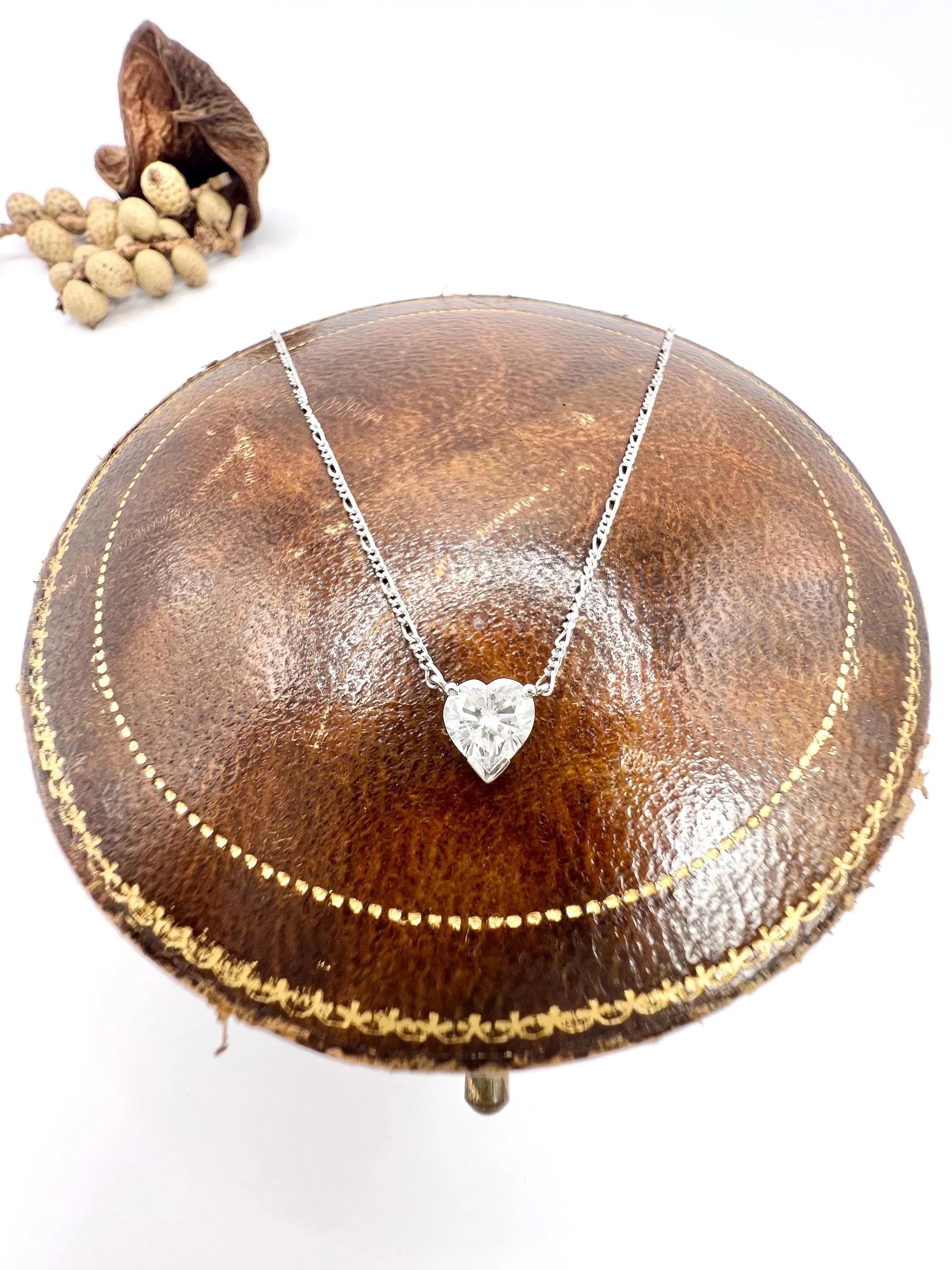 Women's or Men's 0.70 Carat Diamond Heart Pendant Necklace Suspended from a Platinum Figaro Chain For Sale