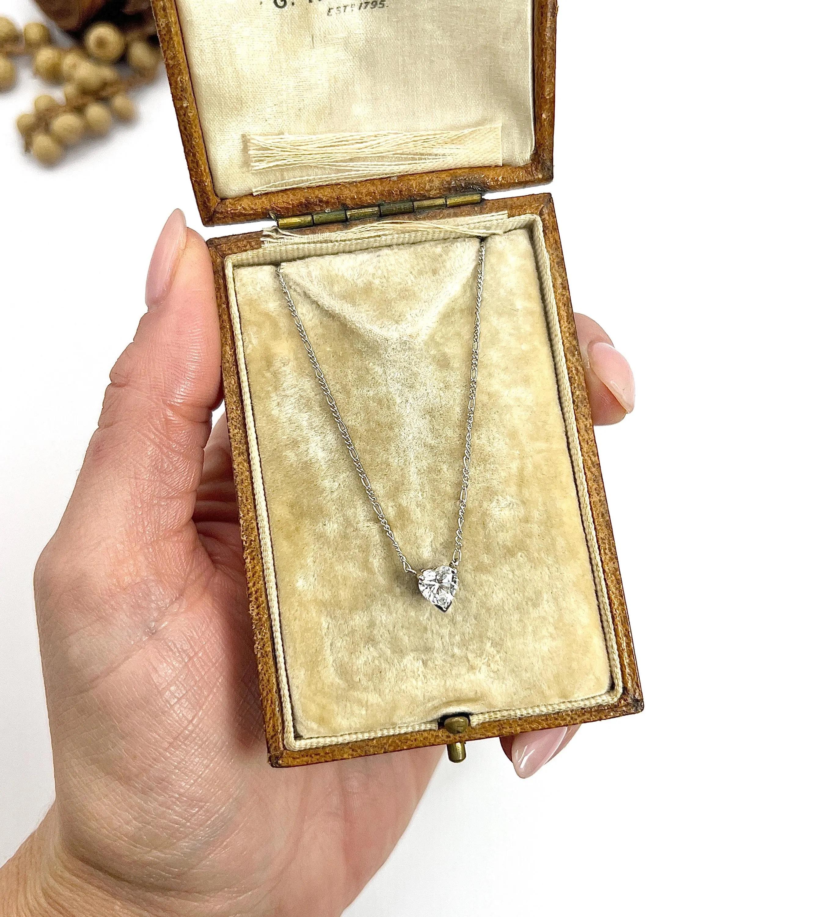0.70 Carat Diamond Heart Pendant Necklace Suspended from a Platinum Figaro Chain For Sale 1