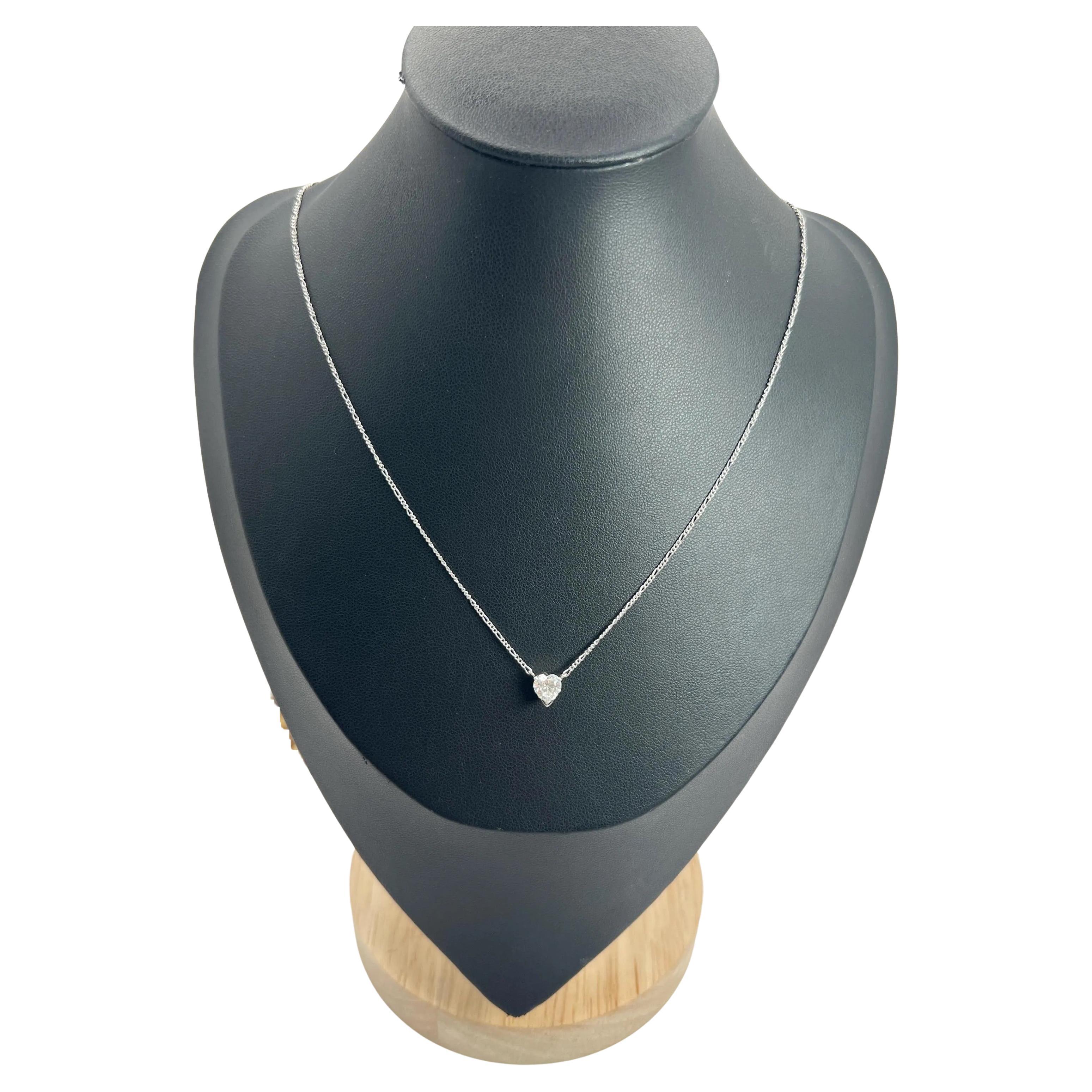 0.70 Carat Diamond Heart Pendant Necklace Suspended from a Platinum Figaro Chain For Sale
