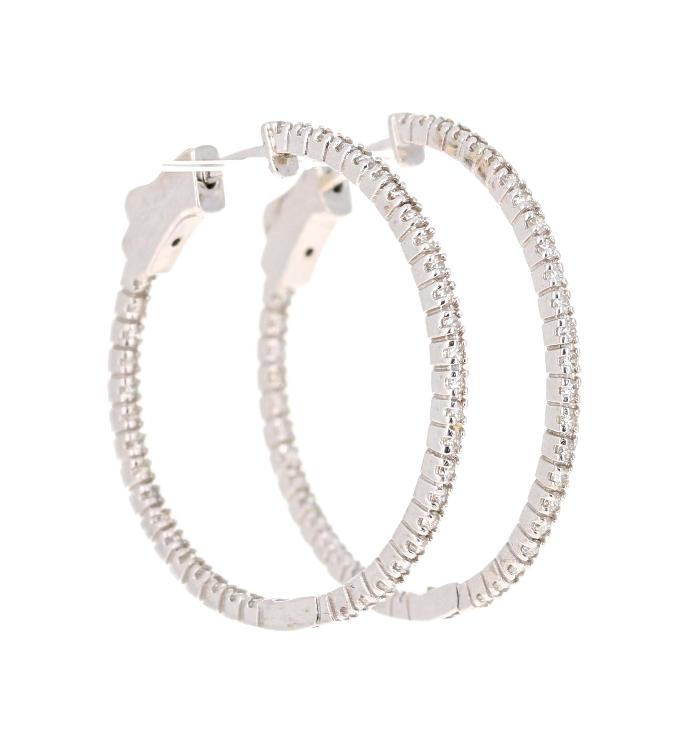 These beautiful and simple earrings are 80 Round Cut Diamonds that weigh 0.70 Carats. 

The hoops are set in 14 Karat White Gold and weigh approximately 4.6 grams. 

The hoops are 1.25 inches.