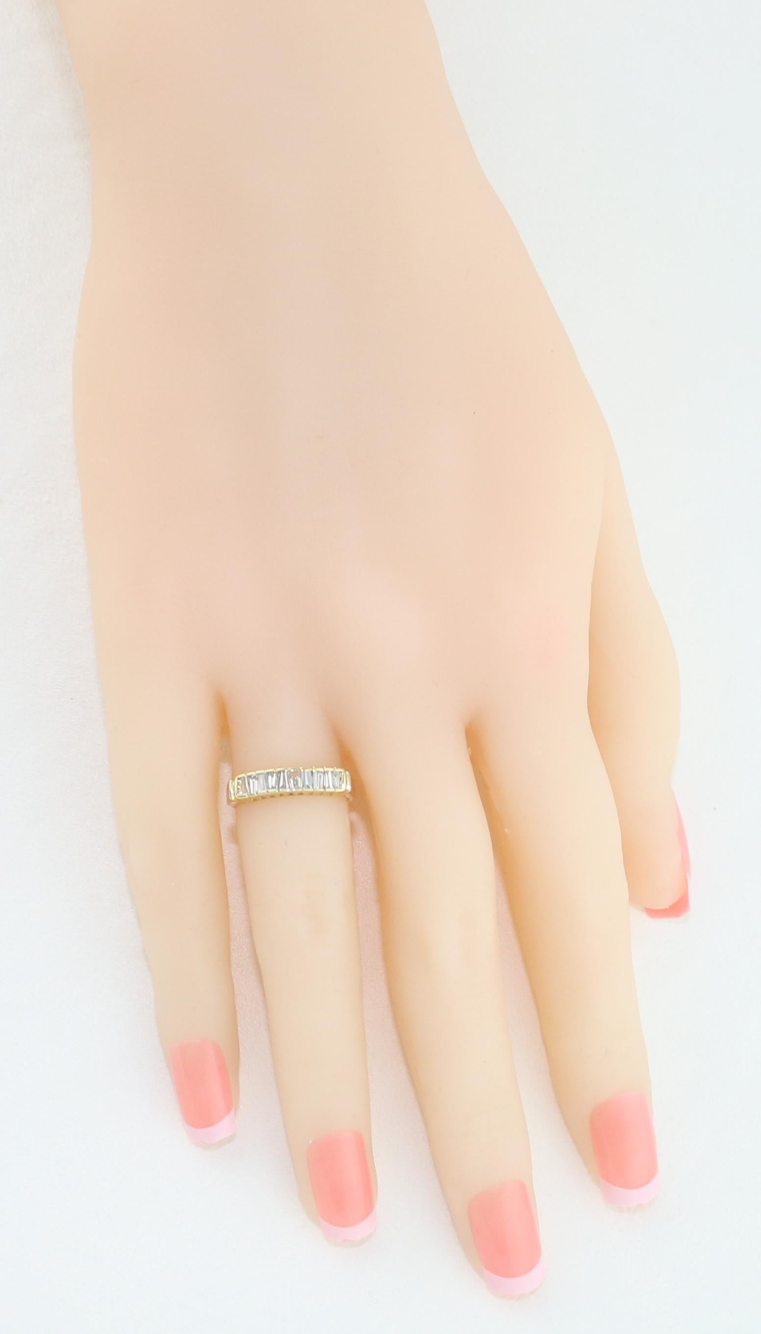 Contemporary 0.70 Carat Diamond Tapered Baguettes Gold Half Band Ring For Sale