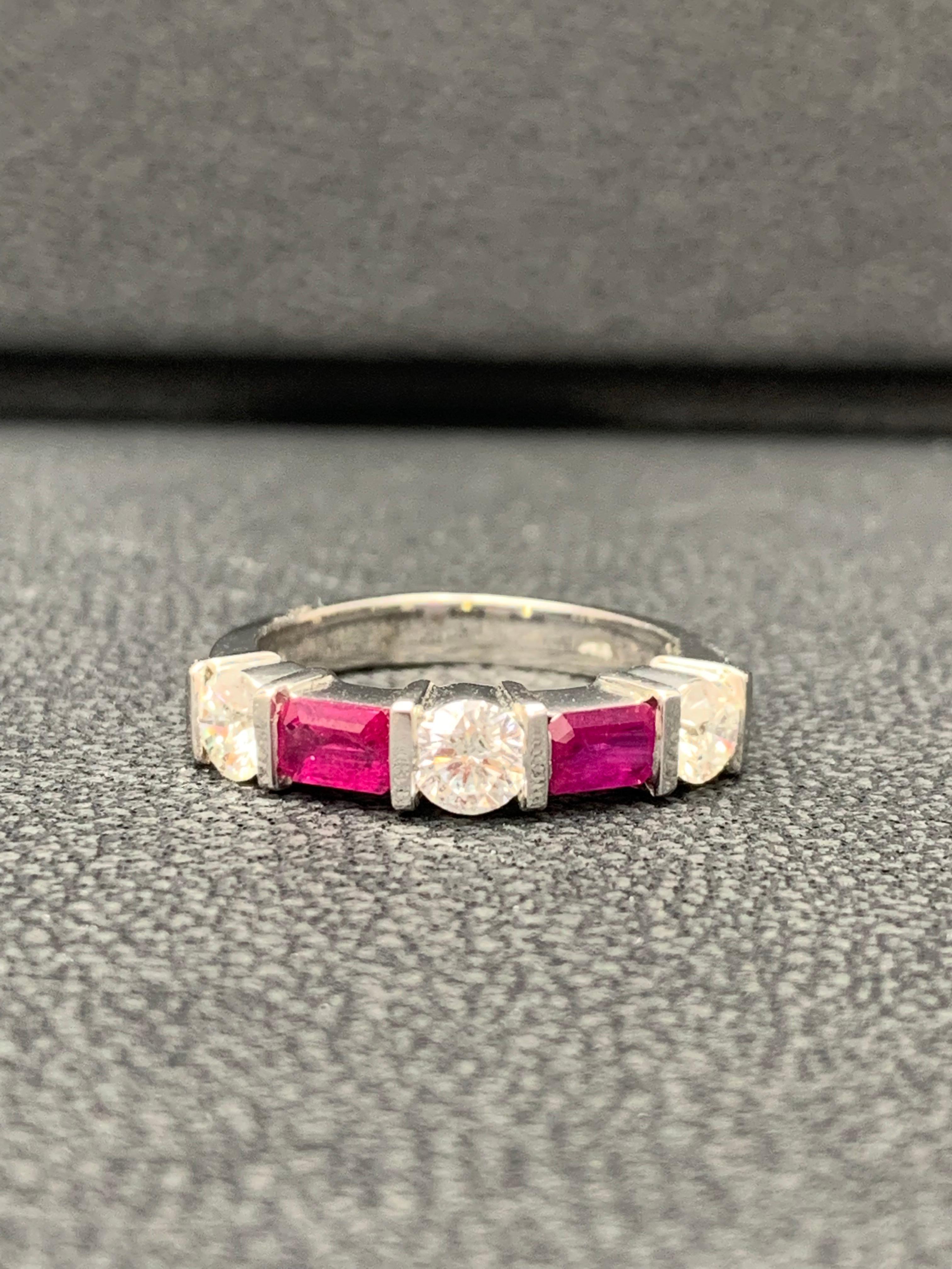 Handcrafted to perfection; showcasing color-rich emerald cut red rubies that elegantly alternate round diamonds in an 14k white gold setting. 
The 2 Rubies weigh 0.70 carats total and 3 diamonds weigh 0.75 carats total.

Size 6.5 US (Sizable). One
