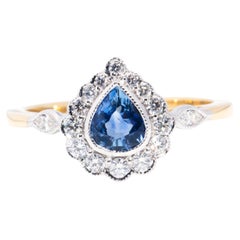 0.70 Carat Natural Sapphire and Diamond 18 Carat Gold Contemporary Halo Ring