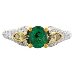 0.70 Carat Oval Emerald and Marquise Fancy Yellow Diamond Two-Tone Cocktail Ring 0.70 Carat Oval Emerald and Marquise Fancy Yellow Diamond Two-Tone Cocktail Ring