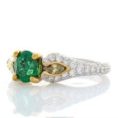 0.70 Carat Oval Emerald and Marquise Fancy Yellow Diamond Two-Tone Cocktail Ring