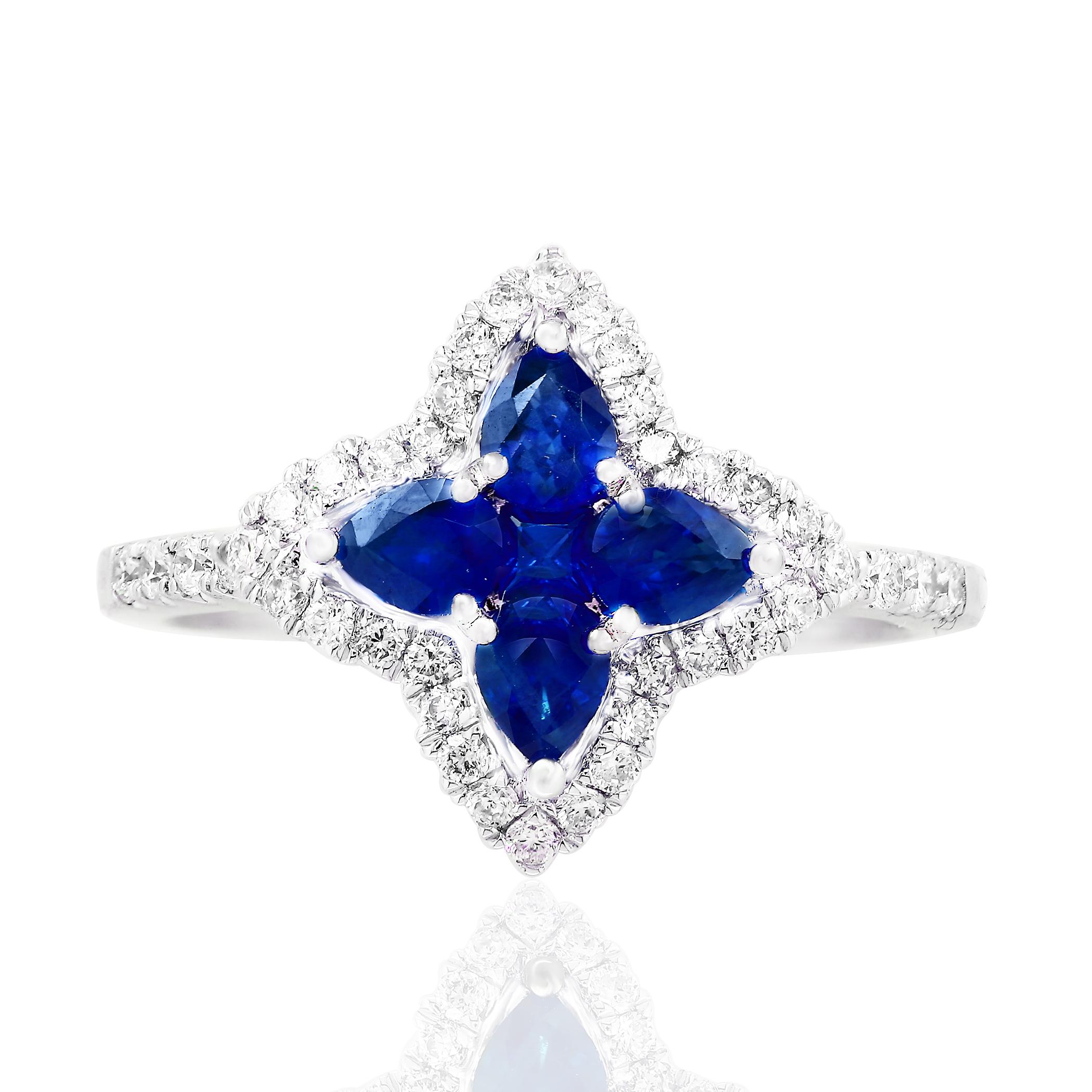 Showcasing flower design color-rich ring with 4 pear shape sapphires weighing 0.70 carats total and 1 round shape sapphire weighing 0.07 carat, accented by a row of round brilliant diamonds. Diamonds weigh 0.35 carats total. Set in a polished 18K